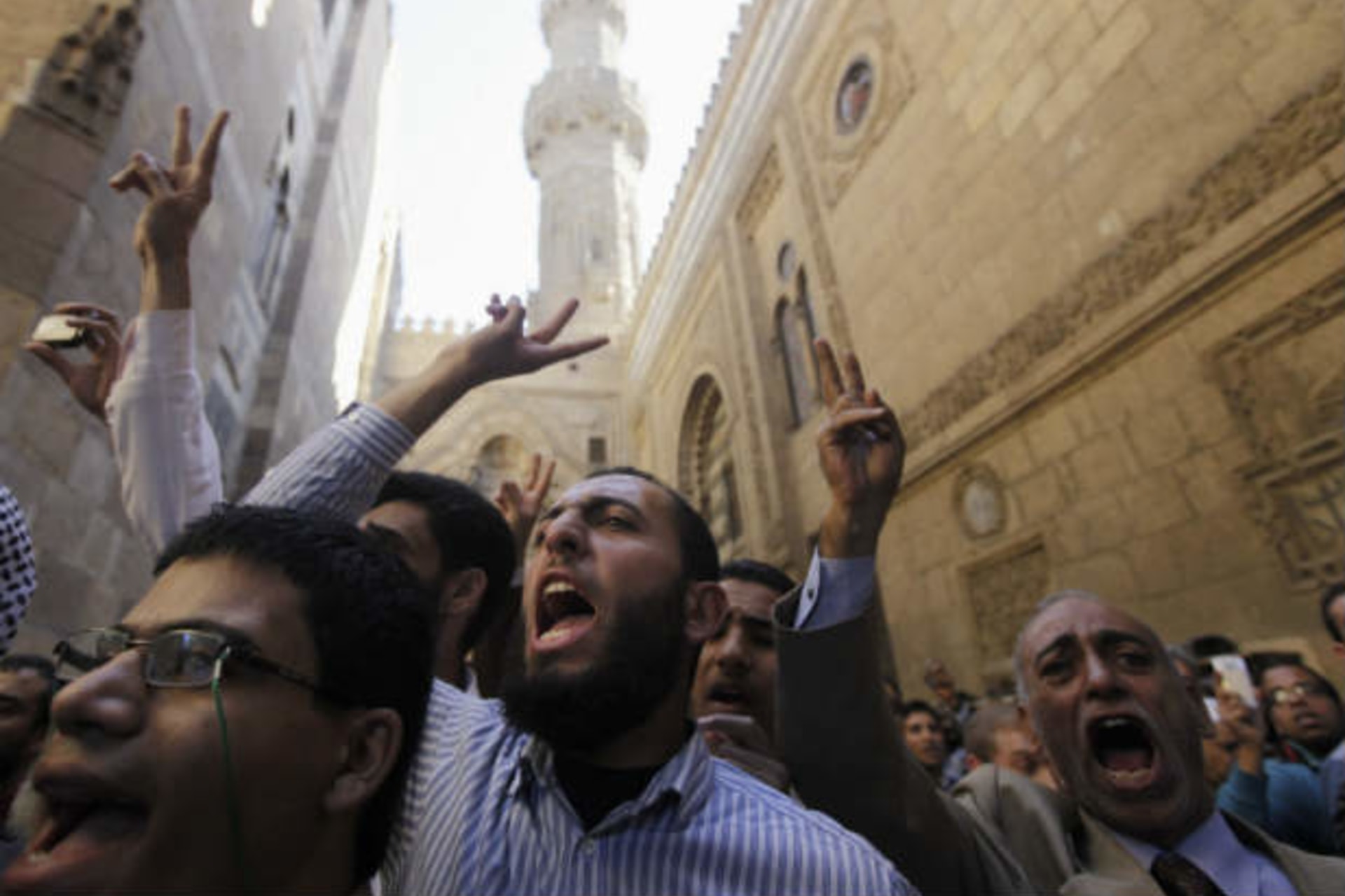 Supporters of Egyptian president Morsi and members of the Muslim Brotherhood shout slogans during a funeral for fellow supporters who died in recent clashes Al Azhar mosque in Cairo on December 7, 2012 (Dalsh/Courtesy Reuters).