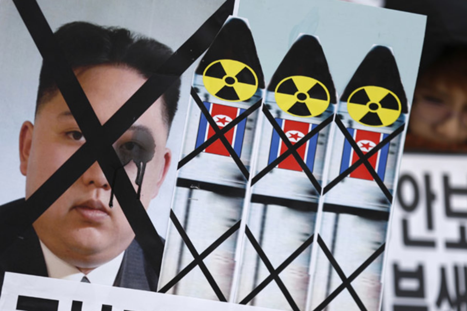 <p>Anti-North Korean activists from conservative and right wing civic groups attend a rally in Seoul denouncing the North’s plan for a rocket launch (Lee Jae-Won/Courtesy Reuters).</p>