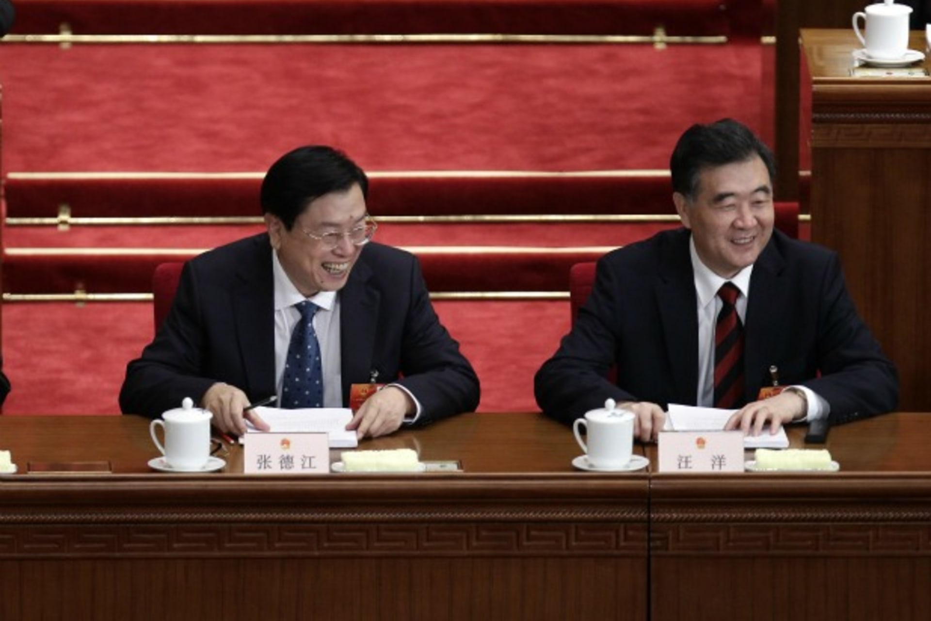 <p>China’s Guangdong Province Party Secretary Wang Yang (R) smiles next to Vice Premier Zhang Dejiang at the second plenary meeting of the National People’s Congress in the Great Hall of the People in Beijing on March 8, 2012.</p>
