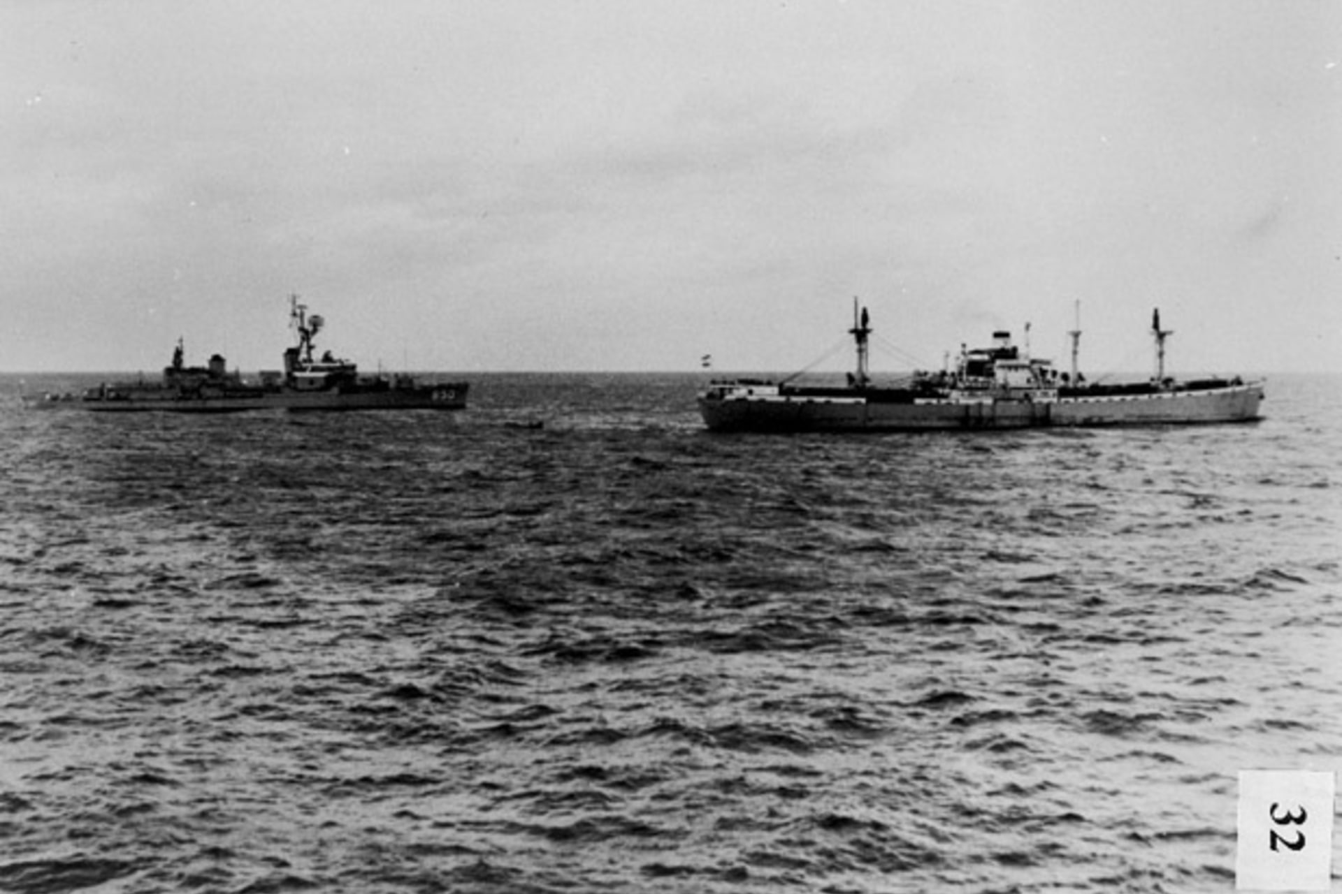 <p>The U.S. destroyer Joseph P. Kennedy stops, boards, and inspects the Marucla, a dry-cargo ship of Lebanese registry under Soviet charter to Cuba. (Dino A. Brugioni Collection, The National Security Archive, Washington, DC)</p>
