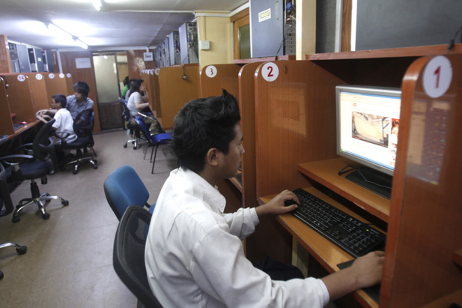 <p>A man looks at YouTube at an Internet cafe in Yangon, Myanmar.</p>
