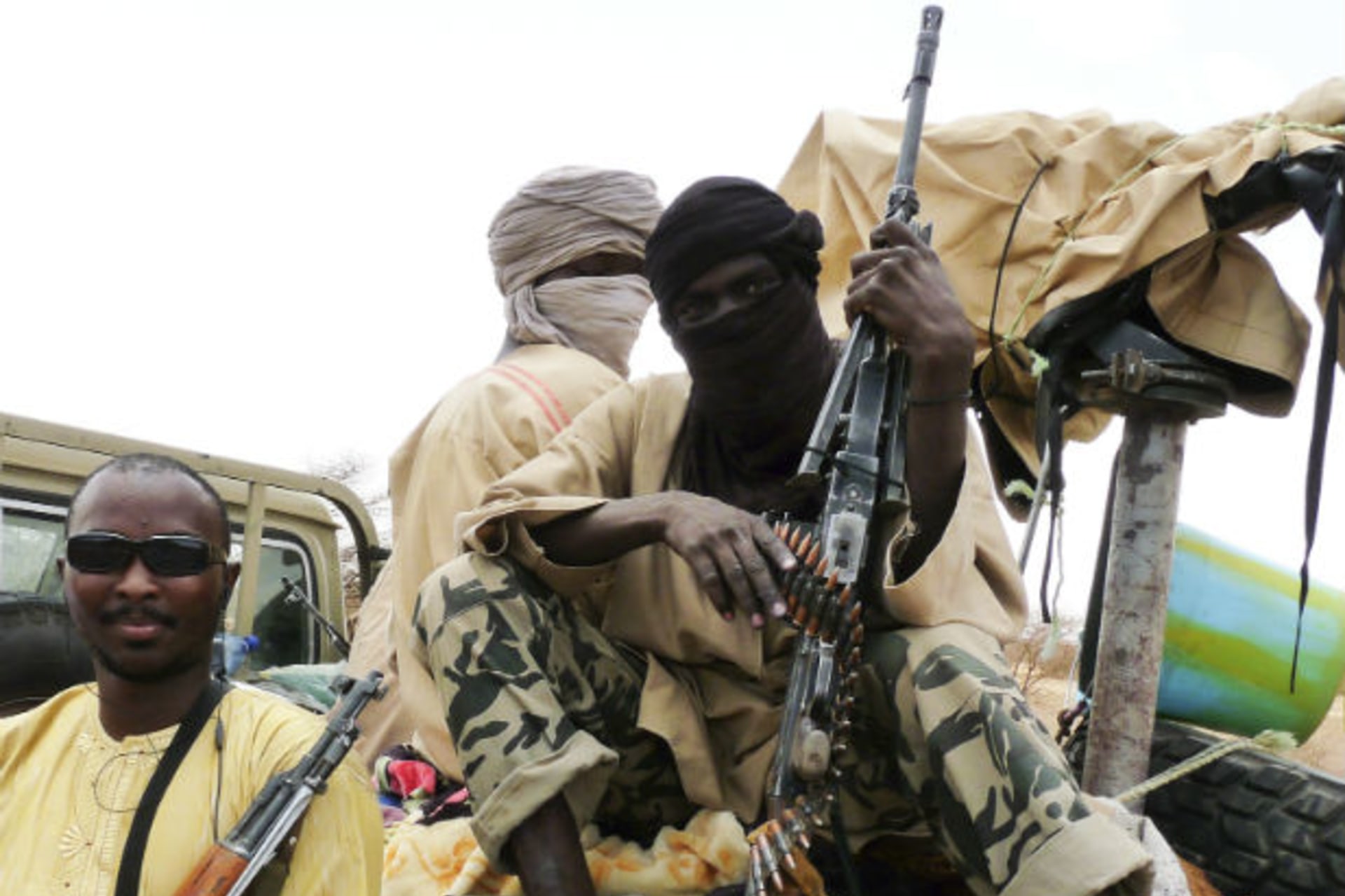 Militiaman from the Ansar Dine Islamic group sit on a vehicle in Gao in northeastern Mali, June 18, 2012.