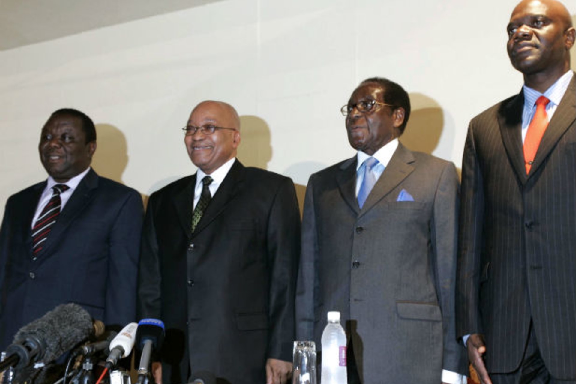 South African President Jacob Zuma (2nd L) poses for a photograph with Zimbabwe's President Robert Mugabe (2nd R), Prime Minister Morgan Tsvangirai (L), and Deputy Prime Minister Arthur Mutambara (R) in the capital Harare, March 18, 2010.