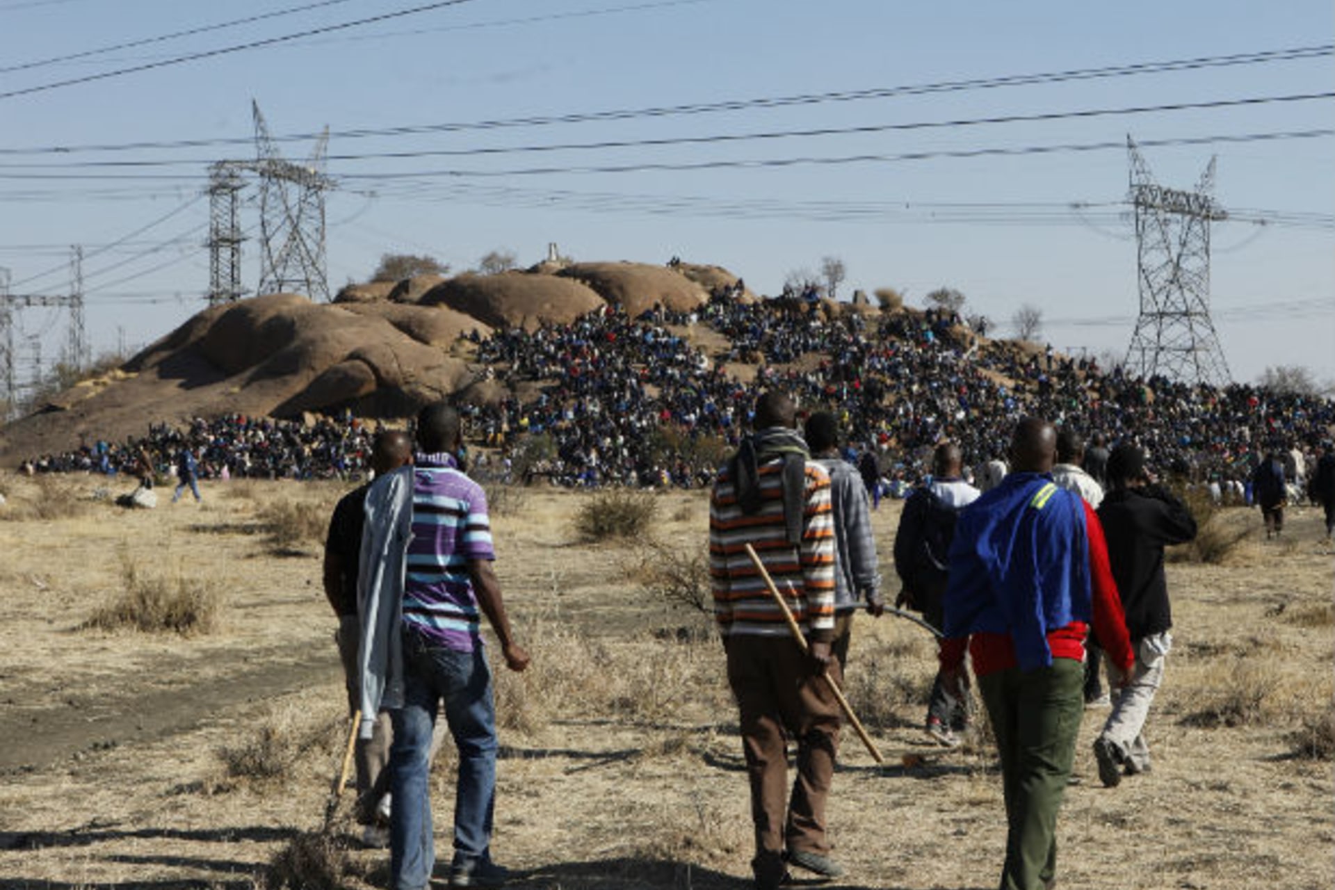 Striking miners arrive at a gathering outside a South African mine in Rustenburg, 100 km (62 miles) northwest of Johannesburg, August 14, 2012.