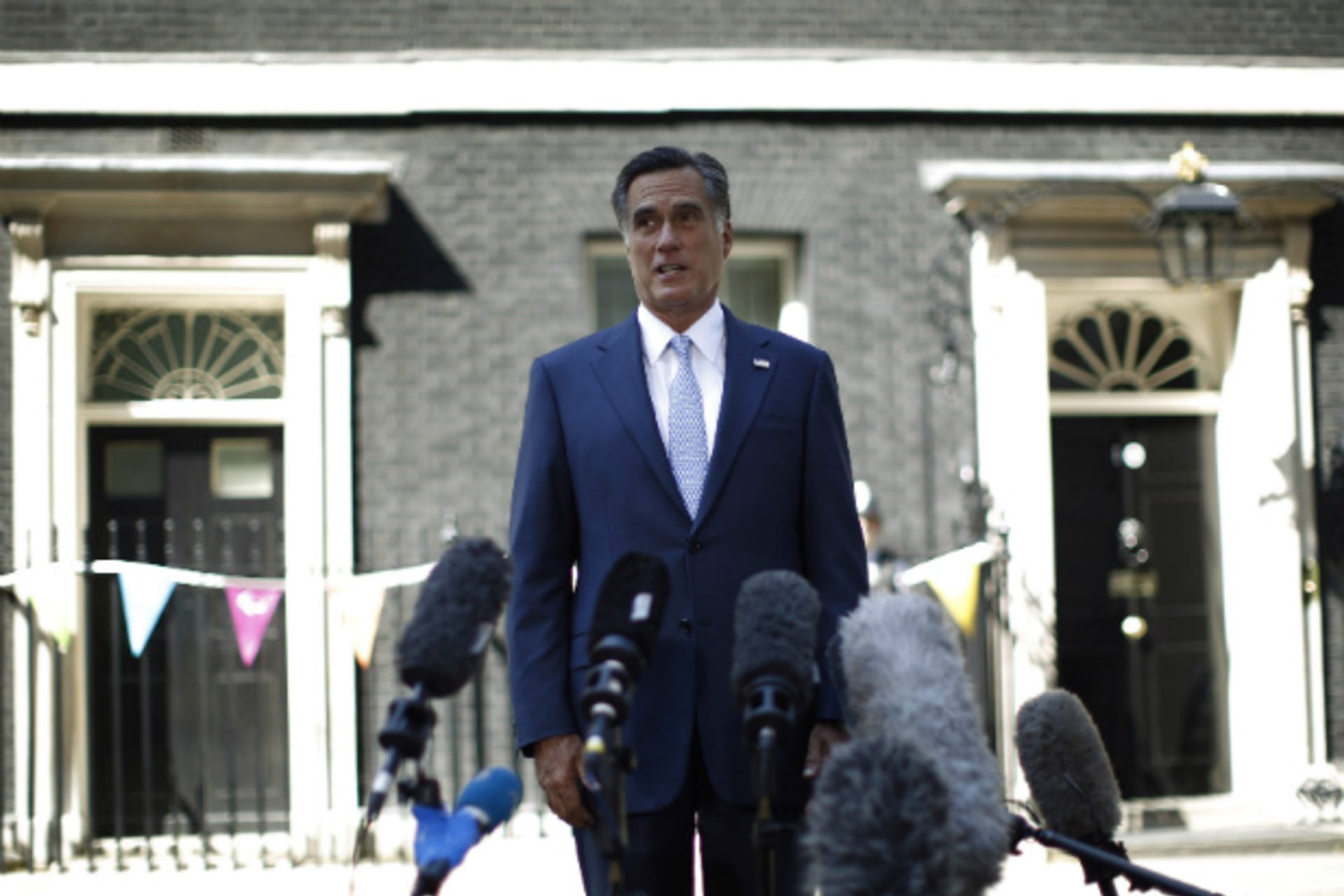 <p>Mitt Romney speaks to the press following a meeting with British prime minister David Cameron and British chancellor of the exchequer George Osborne outside 10 Downing Street in London. (Jason Reed/courtesy Reuters)</p>