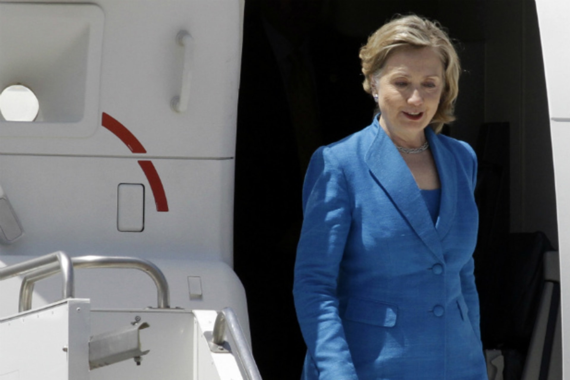 <p>Secretary of State Hillary Clinton exits a plane in Tbilisi, Georgia in July 2012. Clinton begins a two-day visit to Egypt this weekend. (David Mdzinarishvili/courtesy Reuters)</p>
