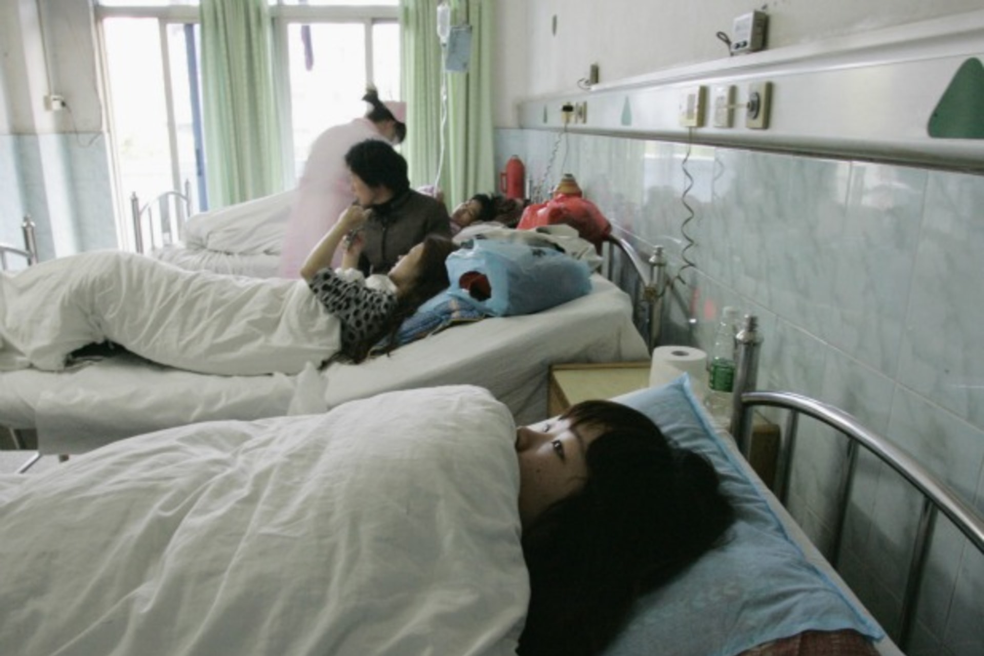 <p>A young Chinese surrogate mother in the maternity ward of Guangzhou’s Taihe Hospital, where she said she was forced into an abortion by the city’s family planning officials, on April 30, 2009.</p>