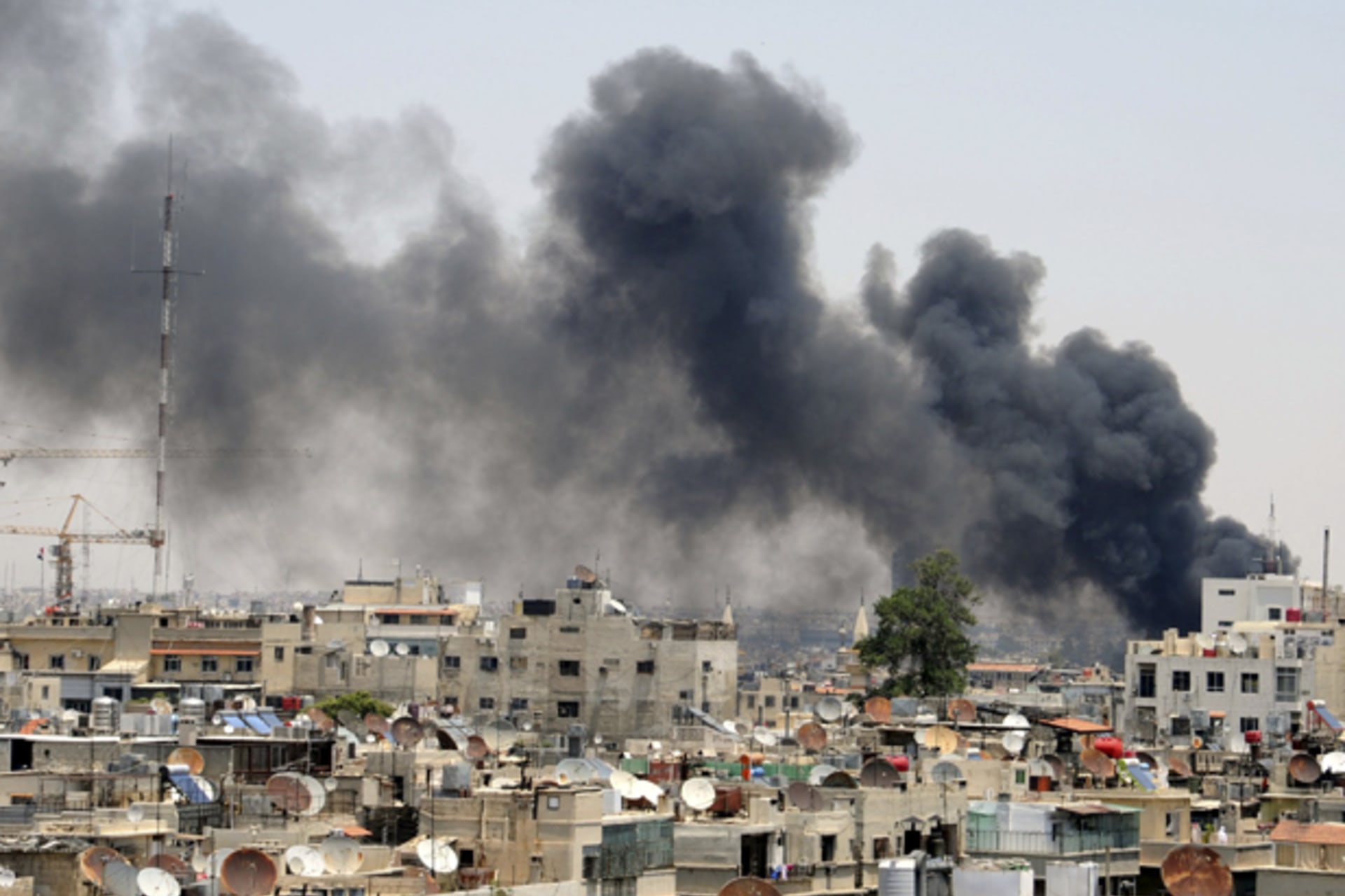 Smokes rises after an explosion was heard near the Palace of Justice in central Damascus