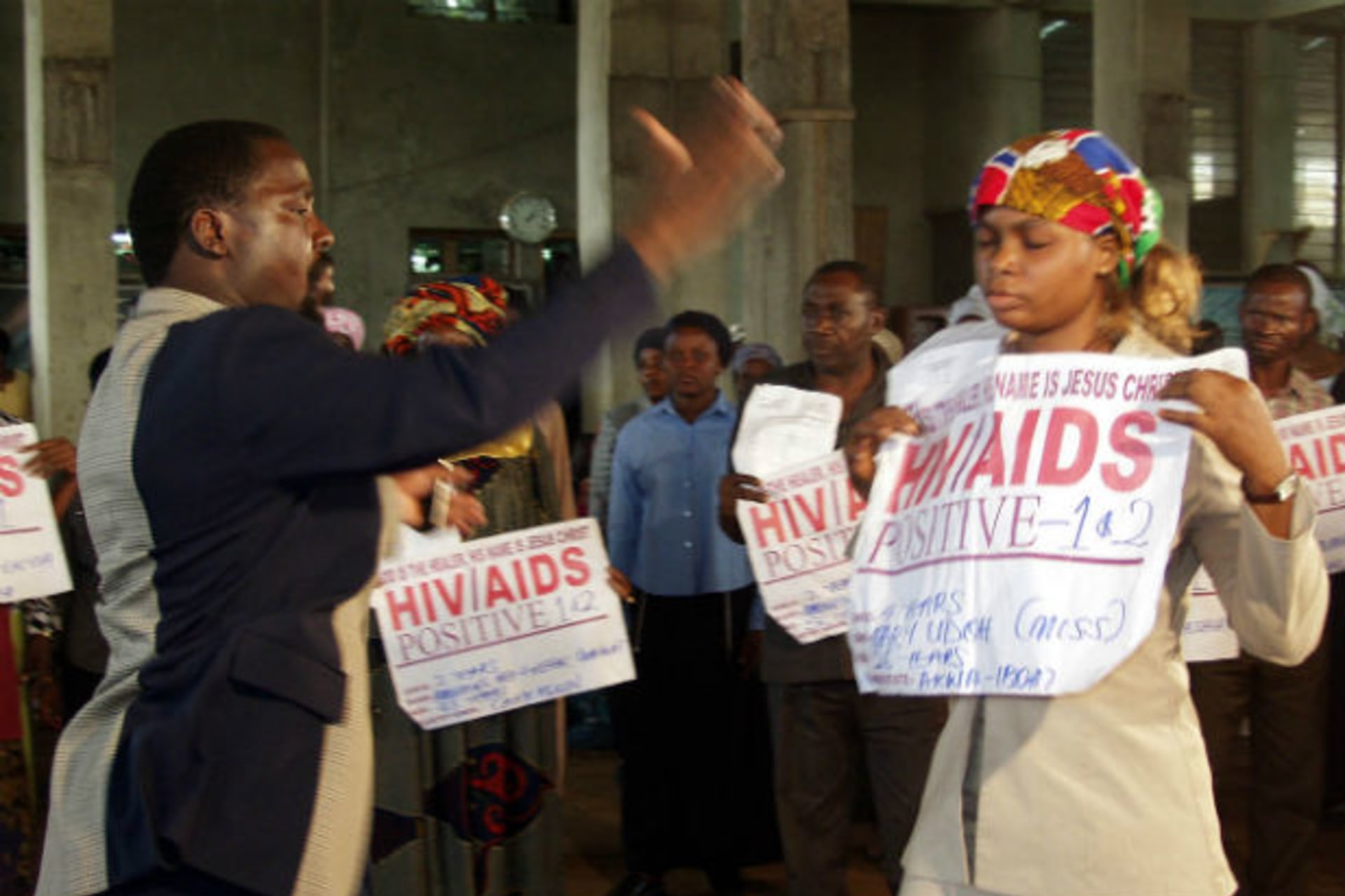 HIV/AIDS patient Miss Mary Udoh receives "miraculous healing" from Prophet T.B. Joshua of the synagogue Church For All Nations during a service at Ikotun-Egbe district in Lagos, the commercial nerve centre of Nigeria, in this January 20, 2003 f
