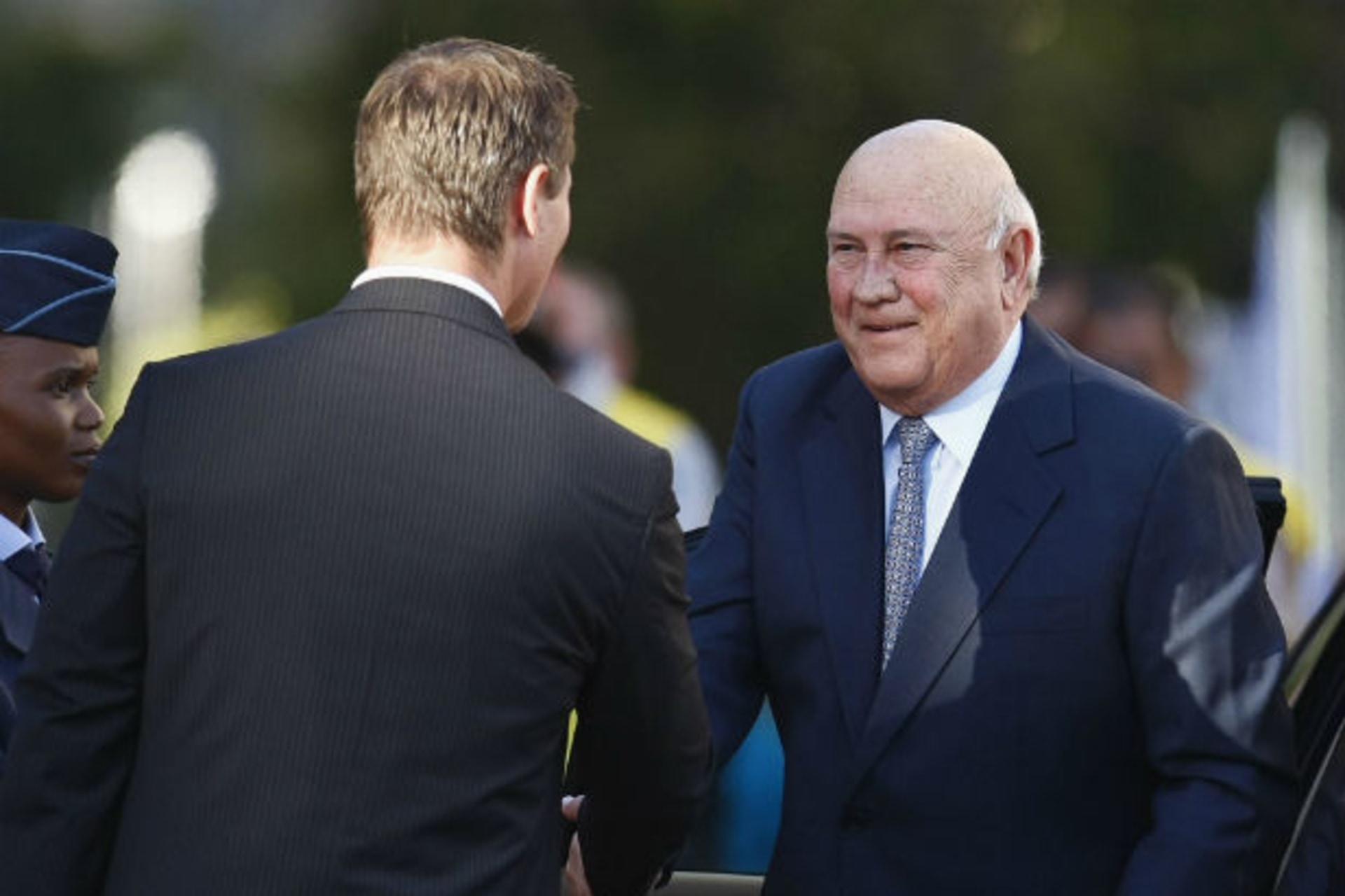 South Africa's former president F.W. De Klerk (R) arrives for the opening of Parliament on the 20th anniversary of Nelson Mandela's release from prison, in Cape Town February 11, 2010
