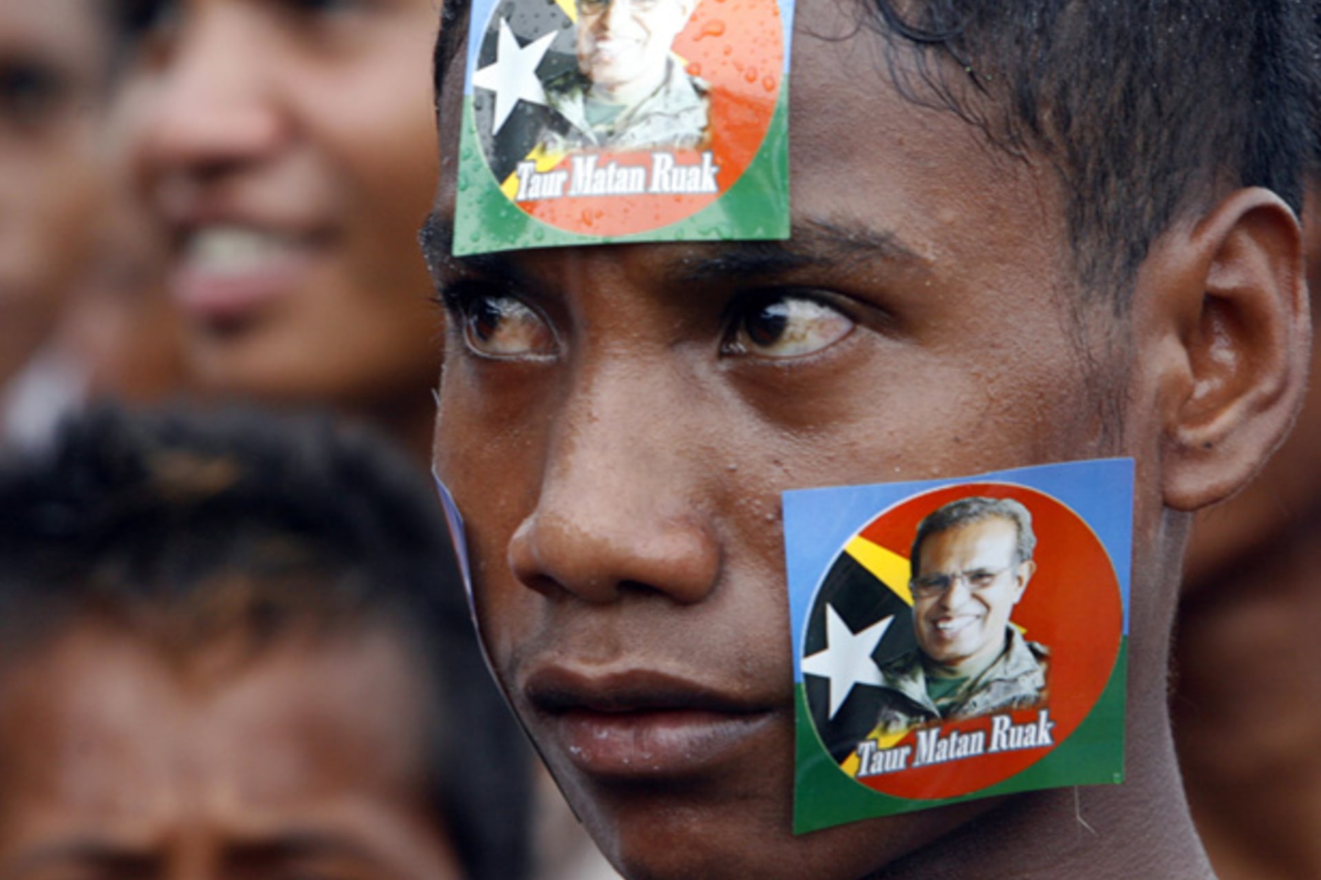 <p>A youth pastes stickers of Timor-Leste’s presidential candidate and former military commander Taur Matan Ruak on his face during a campaign rally in Dili March 10, 2012.</p>
