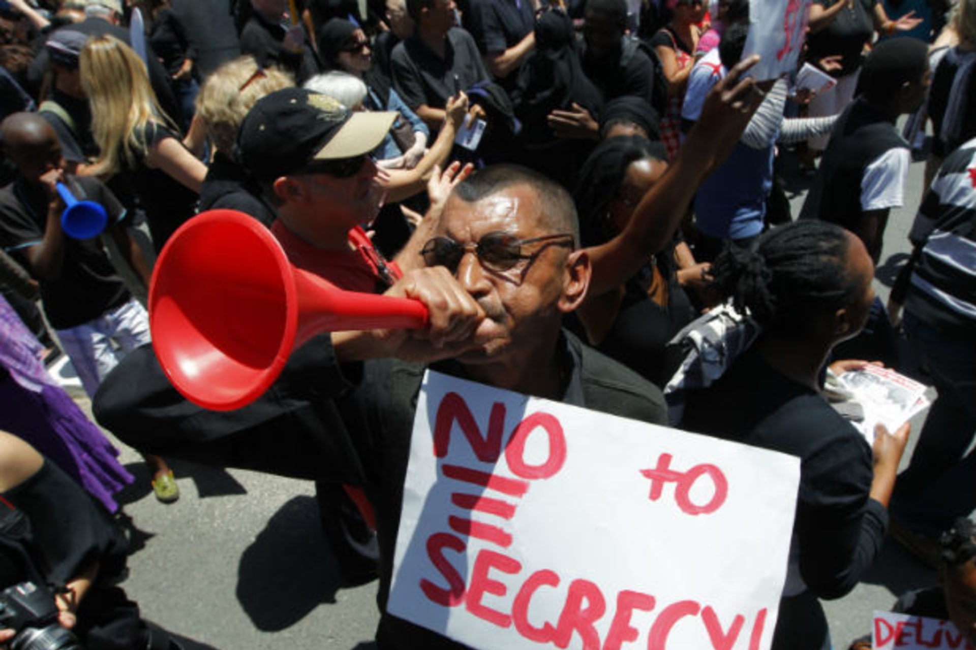 A demonstrator protests against the passing of the Protection of Information Bill outside Parliament in Cape Town, November 22, 2011.
