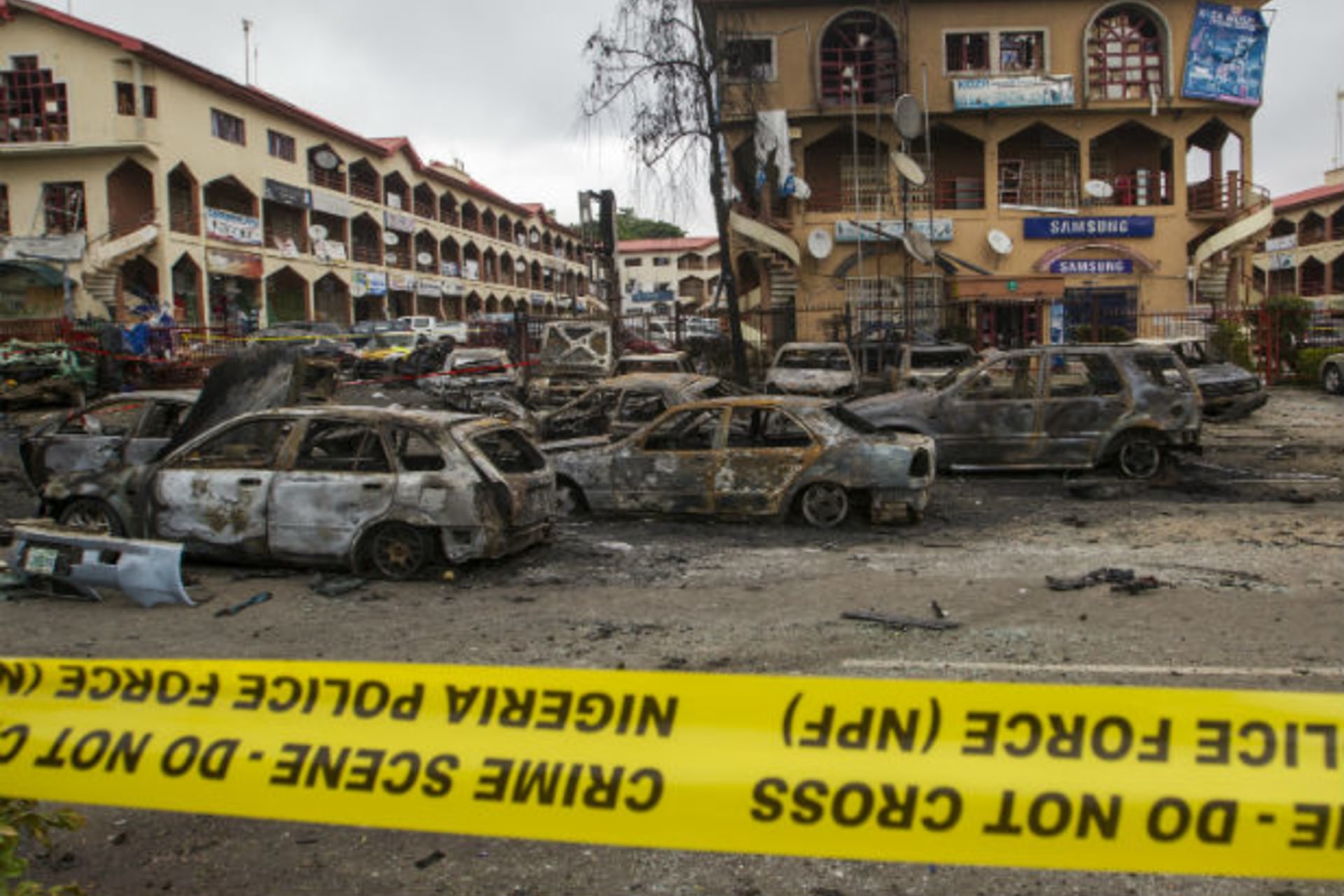 The scene of a bombing at the Emab business centre is pictured filled with wreckages of burnt cars, at the business district in Abuja June 26, 2014. (Afolabi Sotunde/Courtesy Reuters)