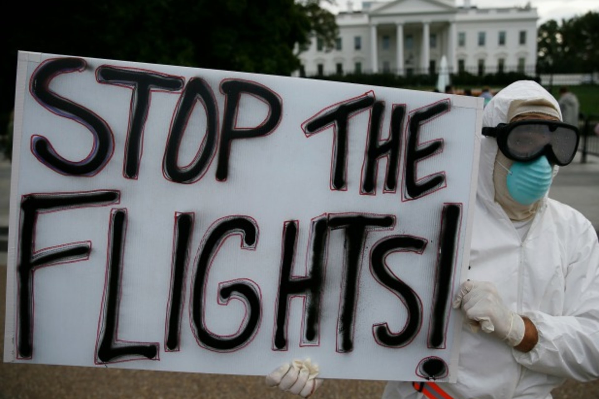<p>Protestor Jeff Hulbert of Annapolis, Maryland holds a sign reading “Stop the Flights” as he demonstrates in favor of a travel …e in Washington October 16, 2014. REUTERS/Jim Bourg (UNITED STATES – Tags: POLITICS HEALTH CIVIL UNREST TPX IMAGES OF THE DAY)</p>