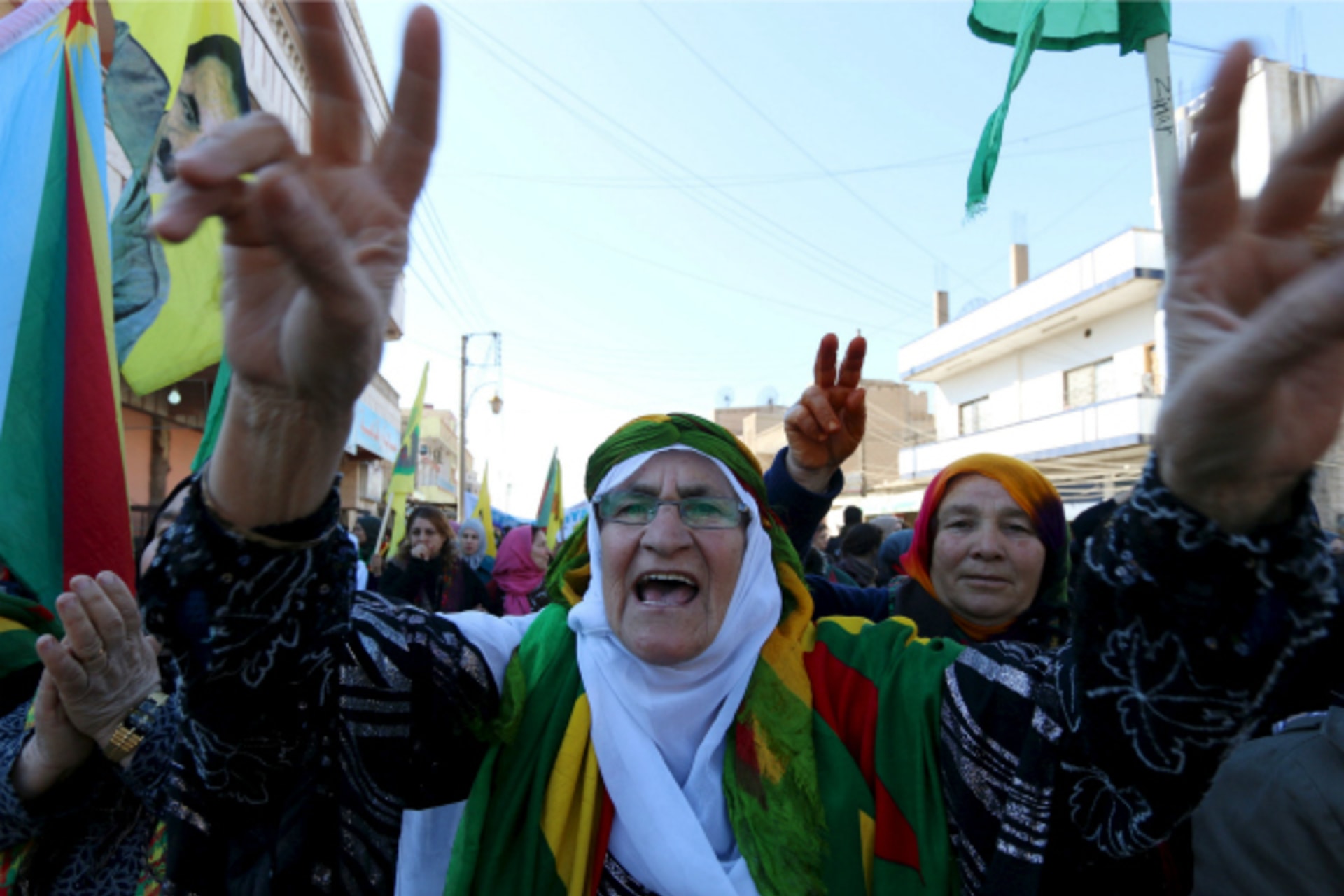 <p>Kurdish women gesture and shout slogans during a demonstration against the exclusion of the Syrian Kurds from the Geneva talks, in the northeast Syrian Kurdish city of Qamishli (Rodi Said/Reuters).</p>

