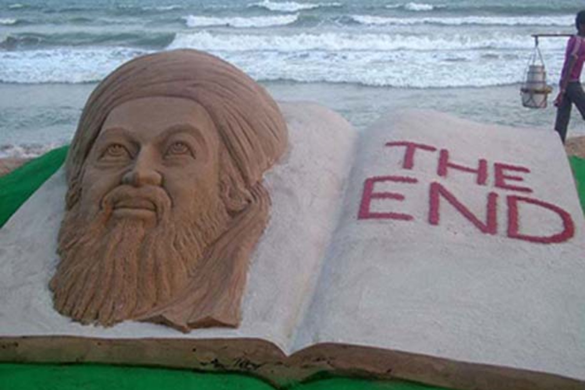 sand sculpture of Al Qaeda leader Osama bin Laden created by Indian sand artist Sudarshan Patnaik on a beach in Puri in the eastern Indian state of Orissa