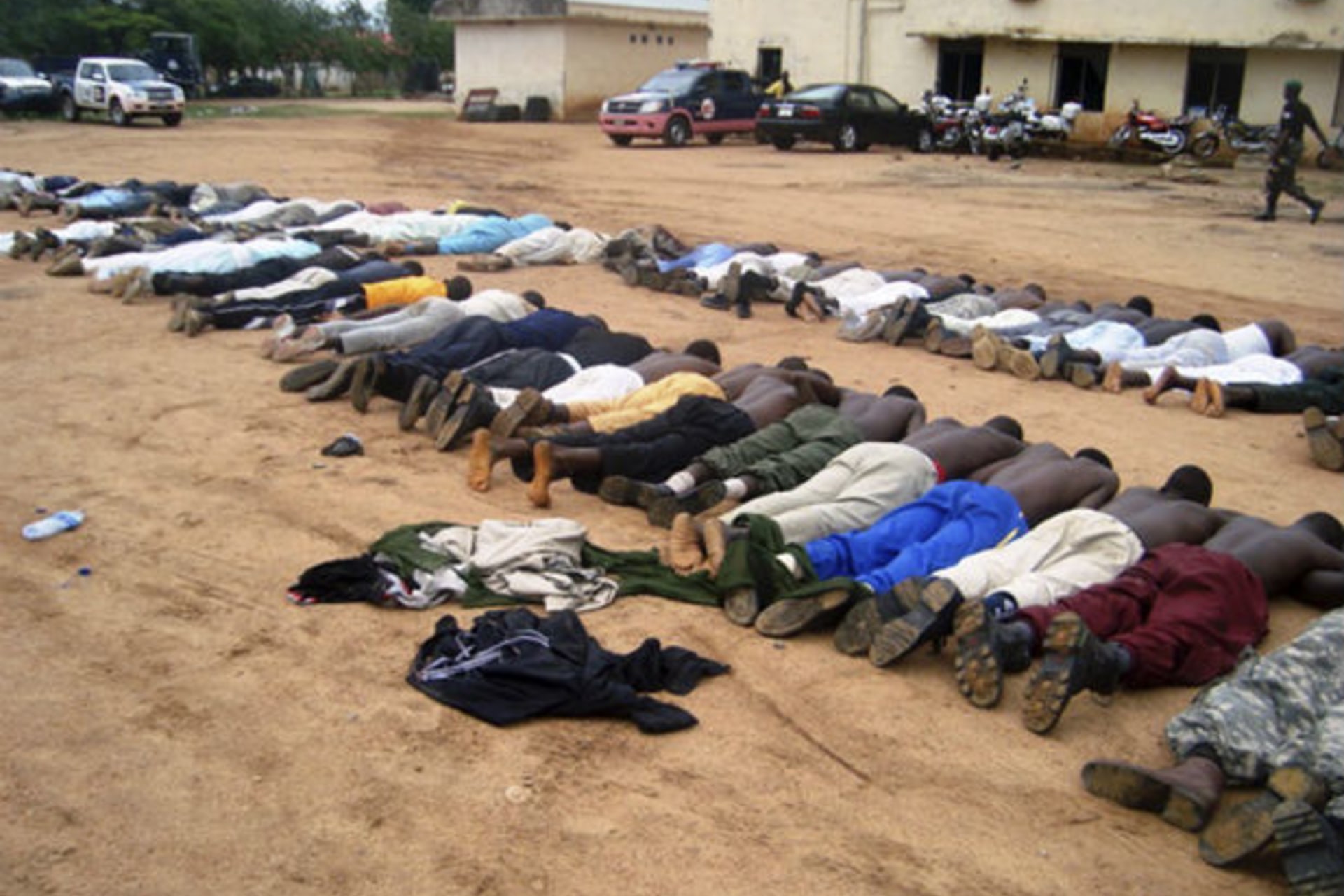 BAUCHI, Nigeria Members of an local Islamic group lie on the ground at a police station after their arrest in the northeastern city of Bauchi, July 25, 2009.