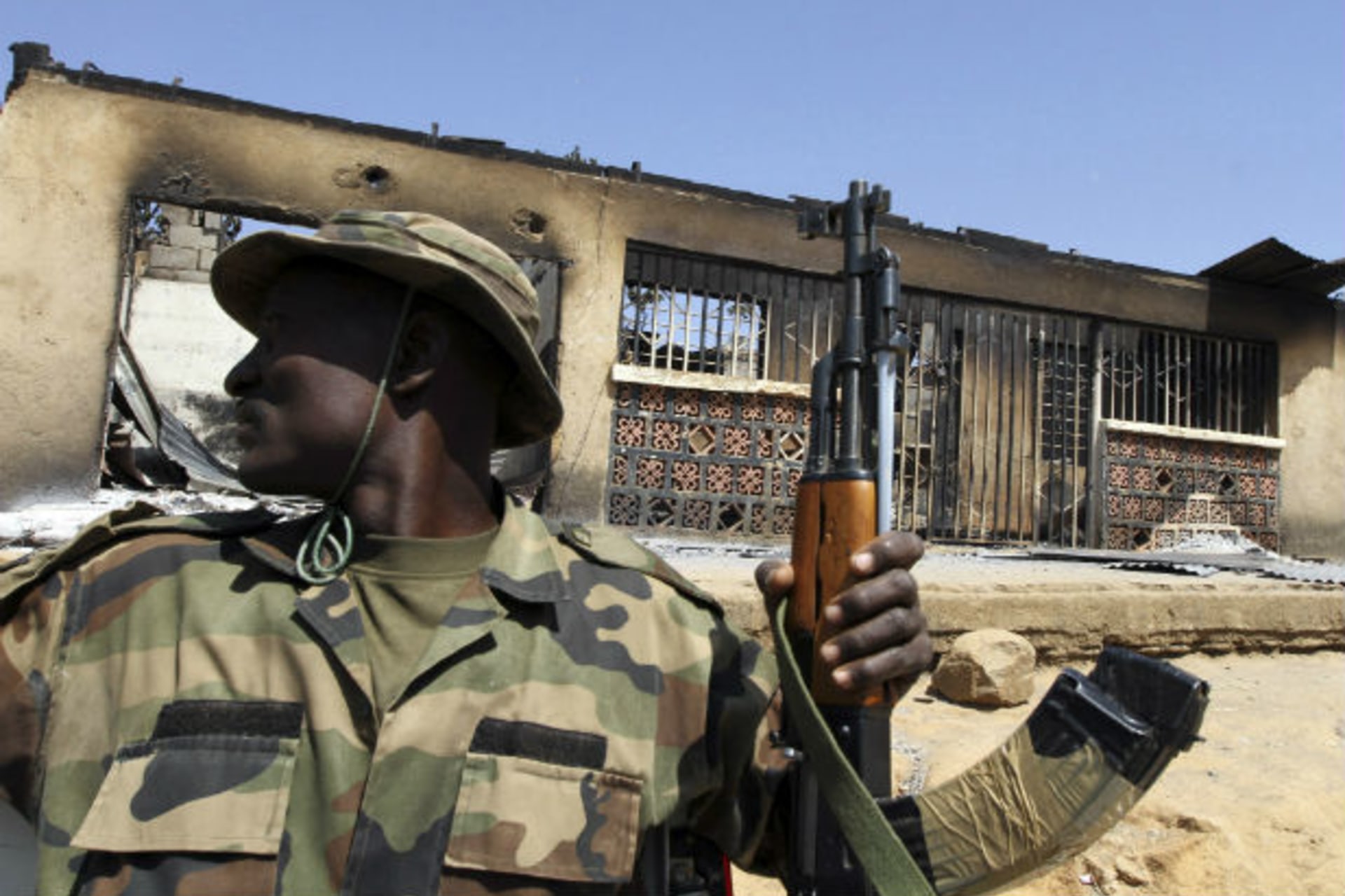 A soldier sits in a truck during a military patrol in Nigeria's central city of Jos 20/01/2010.