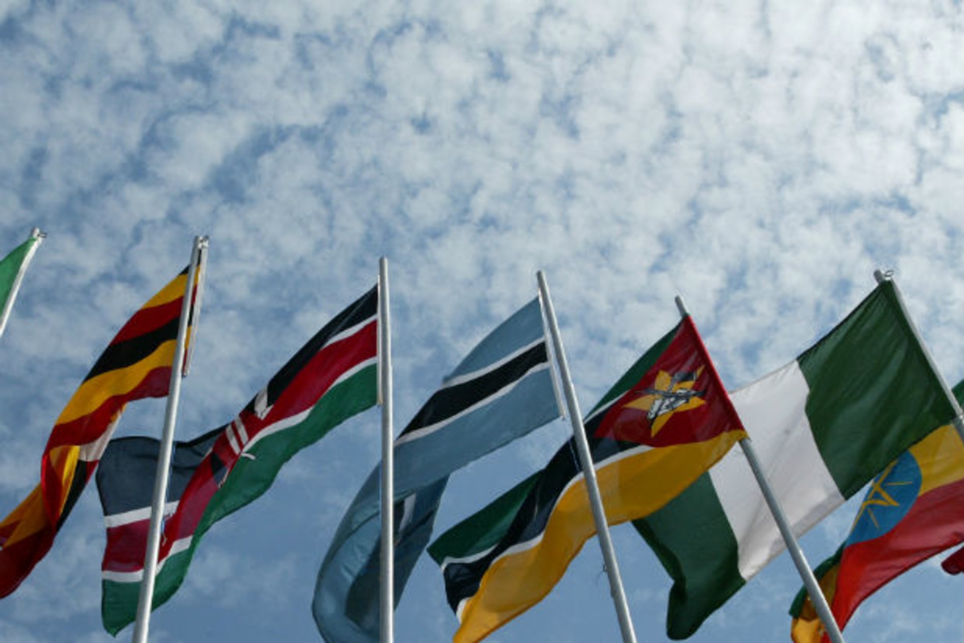 African flags blow in the wind as leaders arrive in Rwanda’s capital Kigali 13/02/2004.
