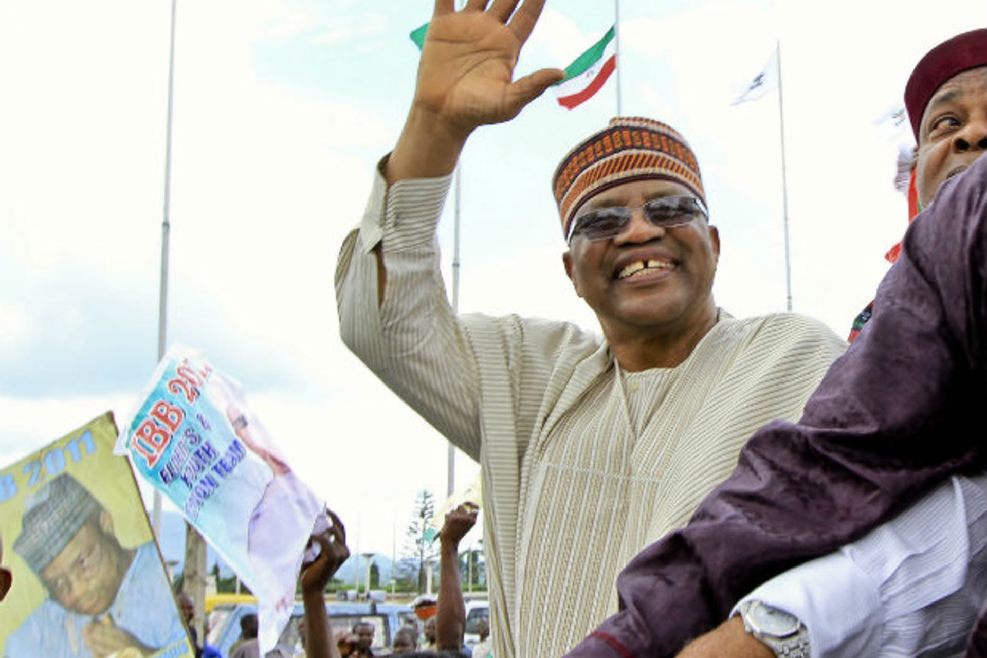 Nigeria's former military ruler Ibrahim Babangida waves to the crowd during a rally marking his official declaration for the presidential bid in the federal capital Abuja September 15, 2010.