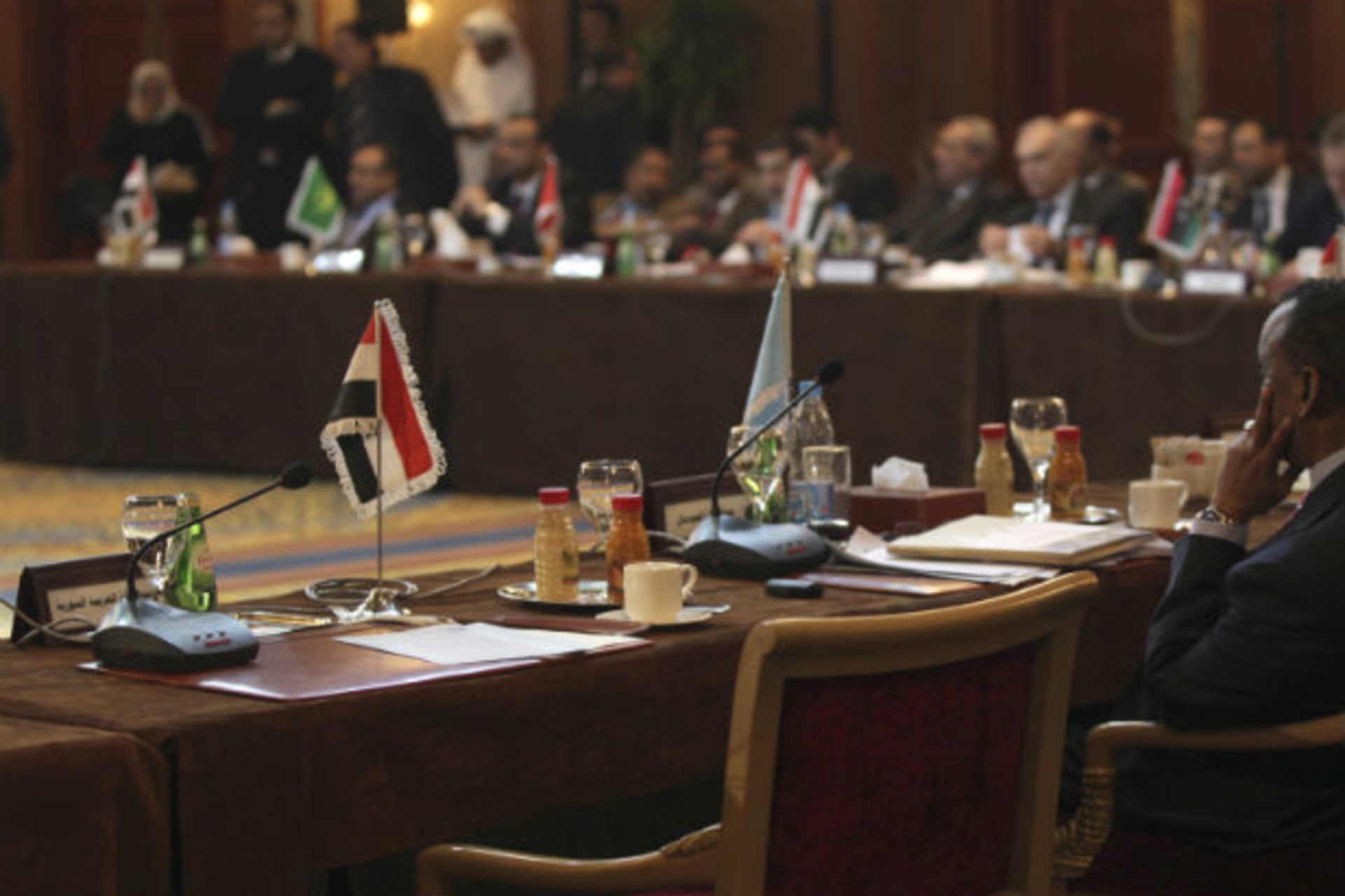 An empty chair for Syria is seen during the Arab foreign ministers meeting in Cairo on February 12, 2012.Arab states will end an Arab observer mission to Syria and call on the UN Security Council to send an international peacekeeping force to e