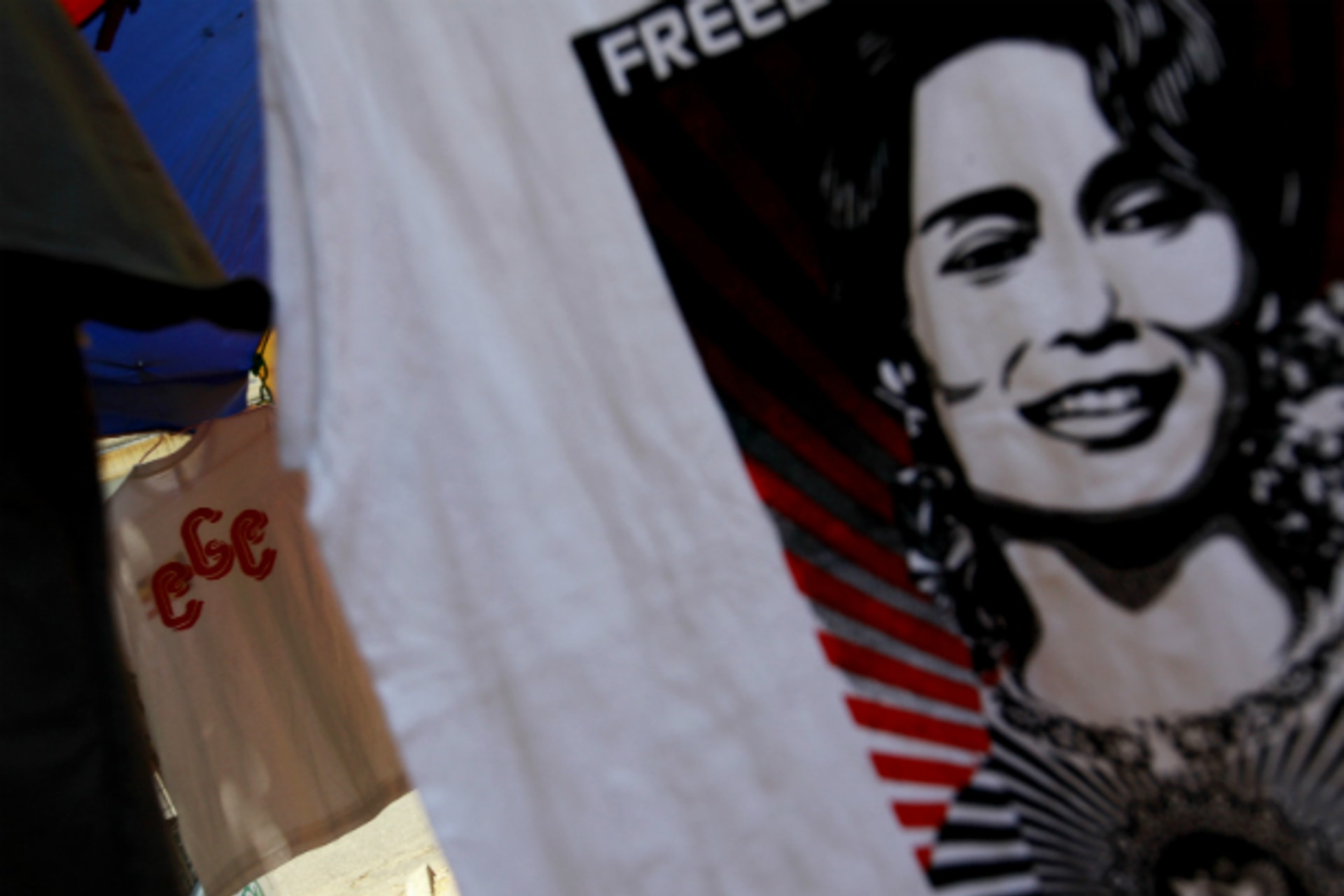 <p>A 969 shirt is seen among National League for Democracy party shirts and Aung San Suu Kyi shirts at a shop on a street side in Yangon on April 27, 2013. (Soe Zeya Tun/Courtesy Reuters)</p>
