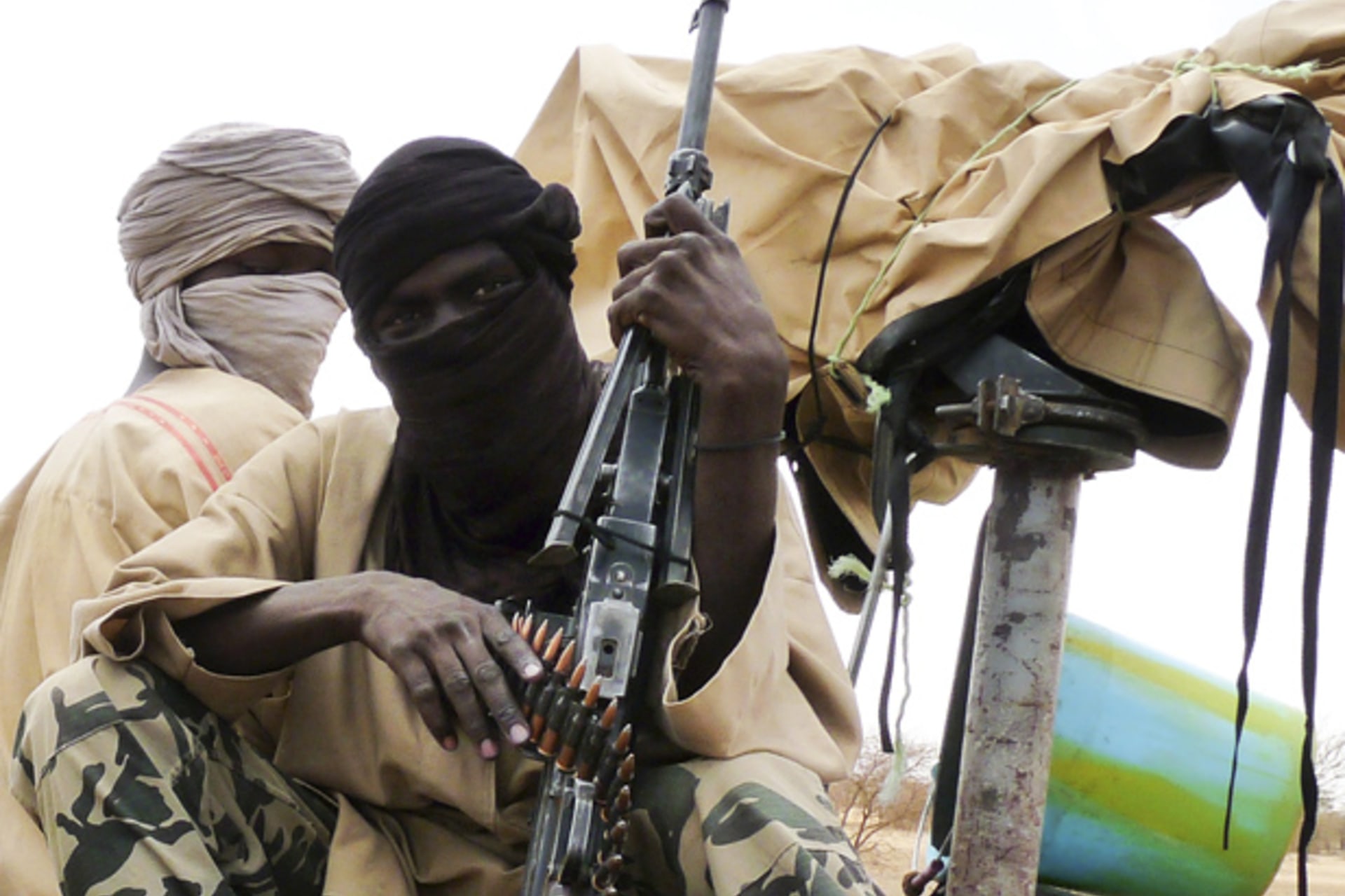Militiaman from the Ansar Dine Islamic group sit on a vehicle in Gao in northeastern Mali