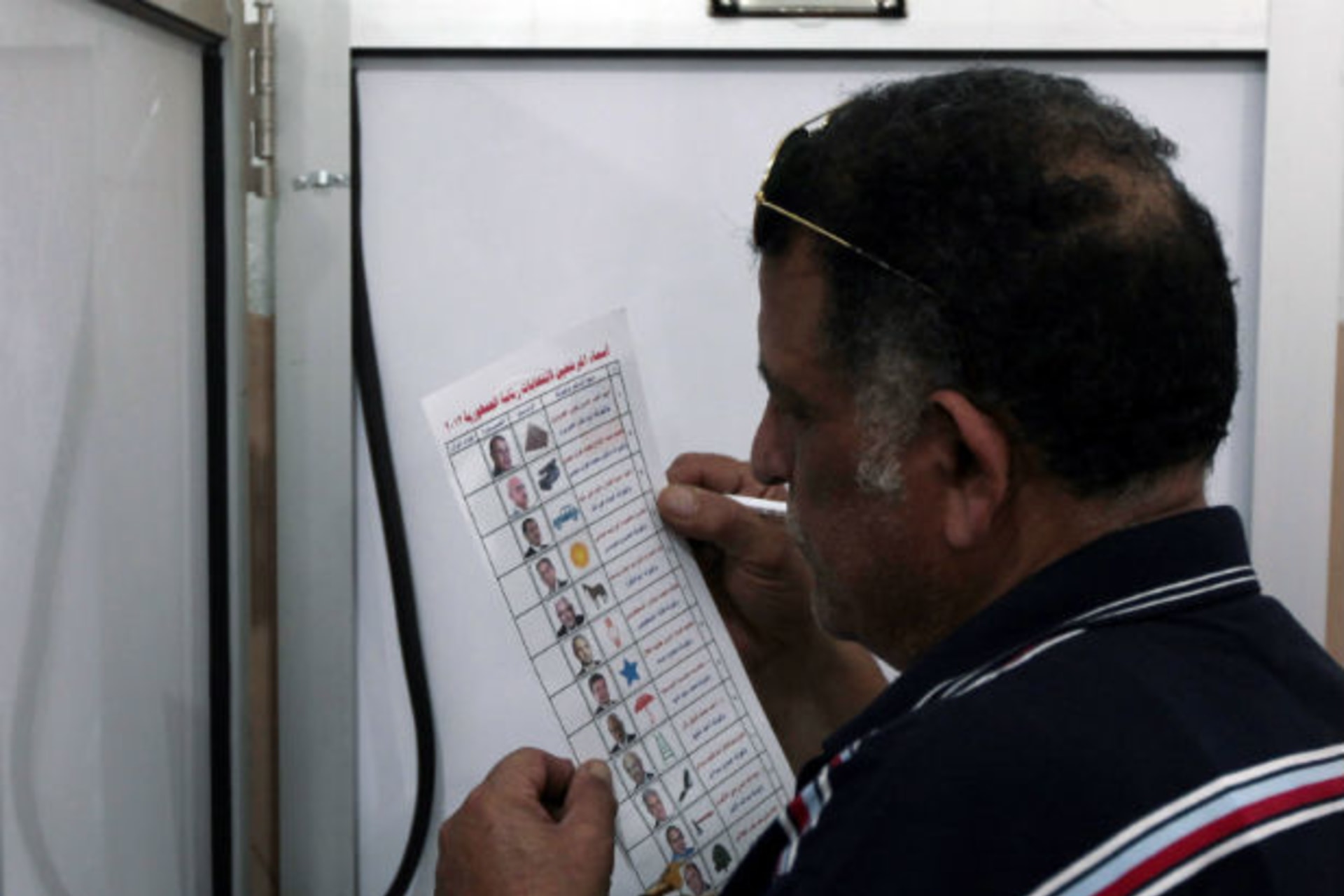 A man holds his ballot sheet as he prepares to vote during Egypt's presidential elections in the Mediterranean city of Alexandria on May 23, 2012 (Mohamed Abd El-Ghany/Courtesy Reuters).