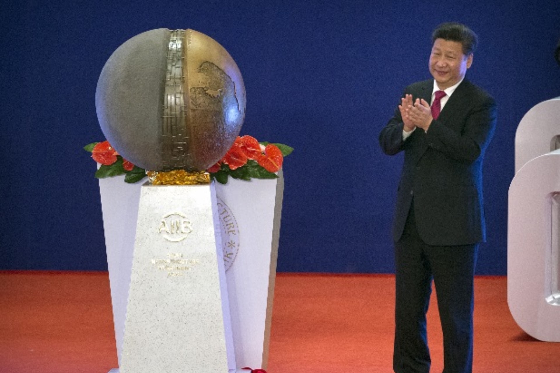 <p>Chinese President Xi Jinping applauds after unveiling a sculpture during the opening ceremony of the Asian Infrastructure Investment Bank (AIIB) in Beijing, China, January 16, 2016. (Mark Schiefelbein/Reuters)</p>
