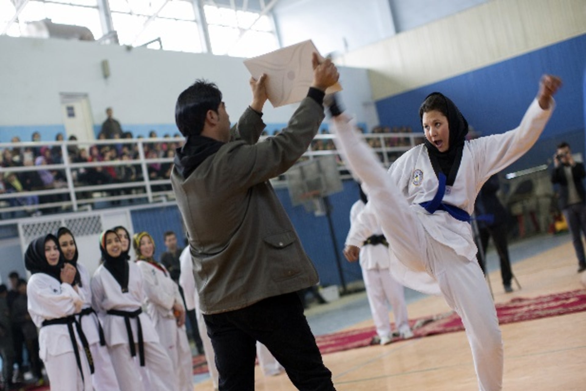 <p>An Afghan athlete performs during a sporting event at a stadium in Kabul March 8, 2014. Despite decades of conflict in Afghani…l anyone who participates. Picture taken March 8, 2014. REUTERS/Morteza Nikoubazl (AFGHANISTAN – Tags: SOCIETY POLITICS SPORT)</p>
