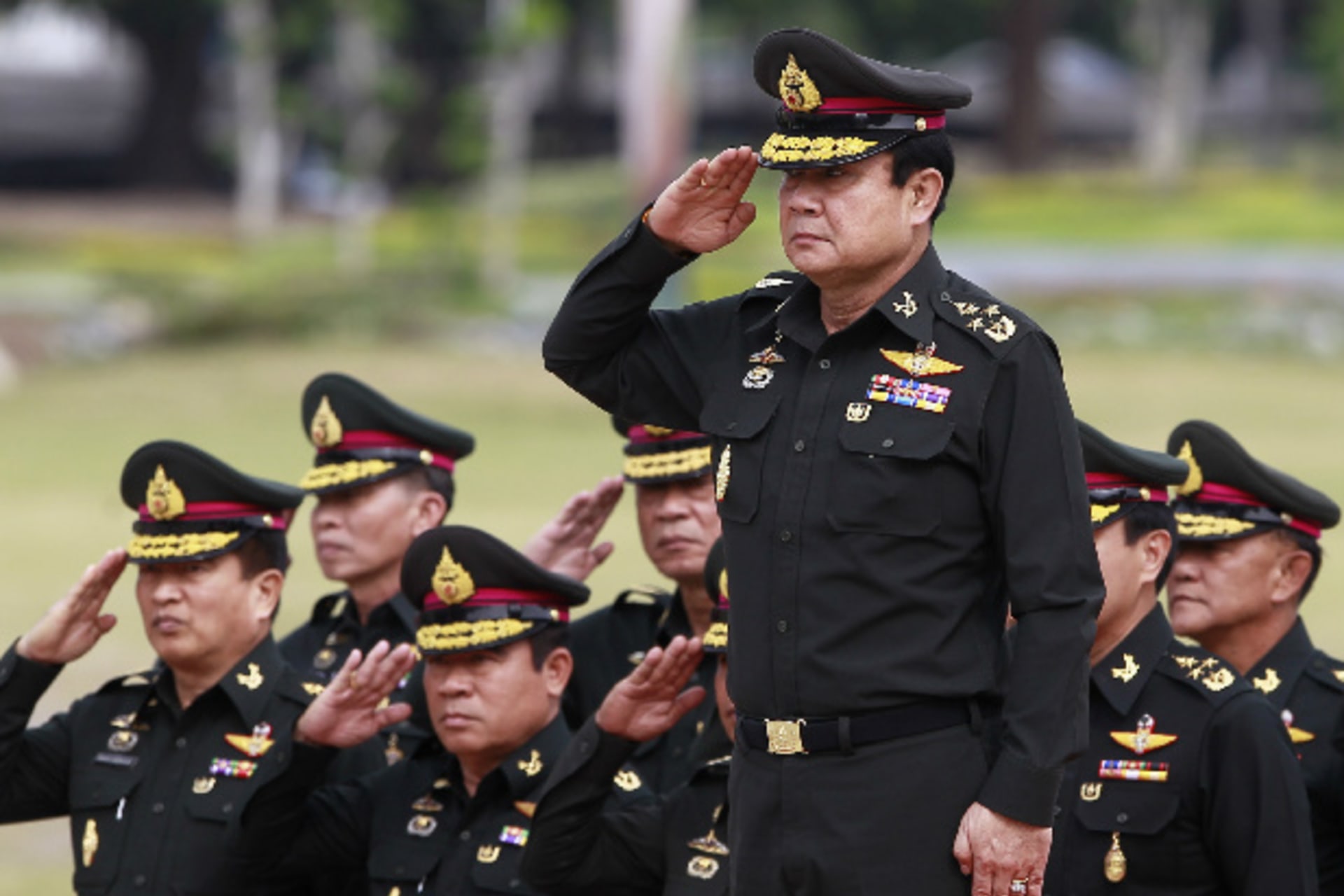 <p>Thailand’s newly appointed prime minister, Prayuth Chan-ocha (front), reviews honor guards on the outskirts of Bangkok on August 21, 2014 (Chaiwat Subprasom/Courtesy Reuters).</p>
