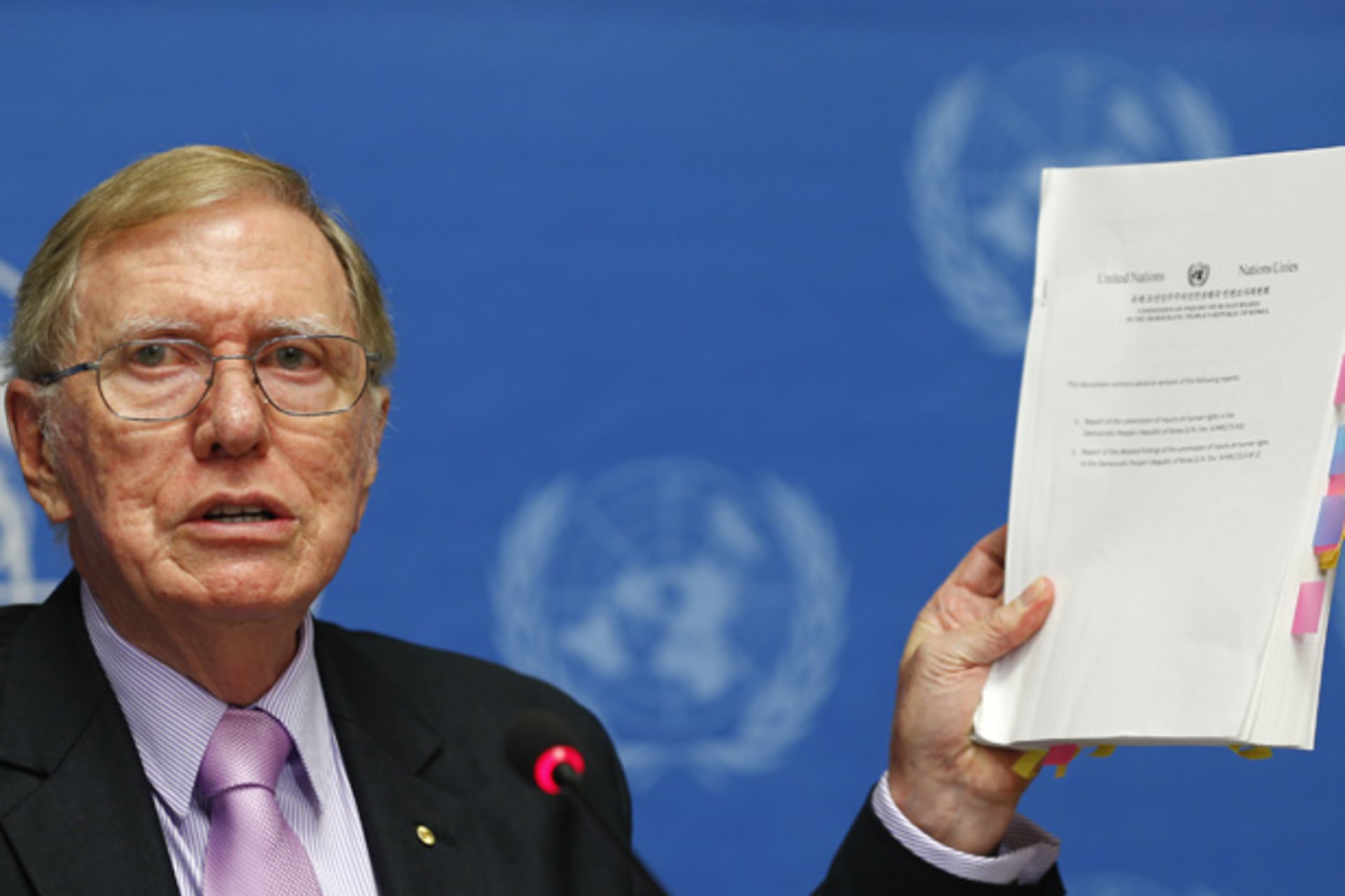 <p>Michael Kirby, Chairperson of the Commission of Inquiry on Human Rights in North Korea holds a copy of his report during a news conference at the United Nations in Geneva February 17, 2014</p>
