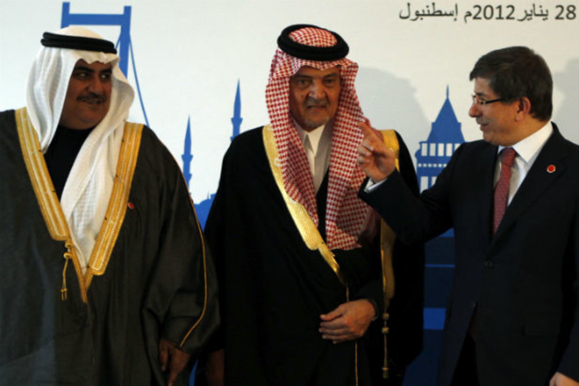 Foreign Ministers Sheikh Khaled bin Ahmed al-Khalifa of Bahrain, Prince Saud al-Faisal of Saudi Arabia, and Ahmet Davutoglu of Turkey pose for a group photo during the fourth ministerial meeting of Turkey and the Gulf Cooperation Council (GCC)