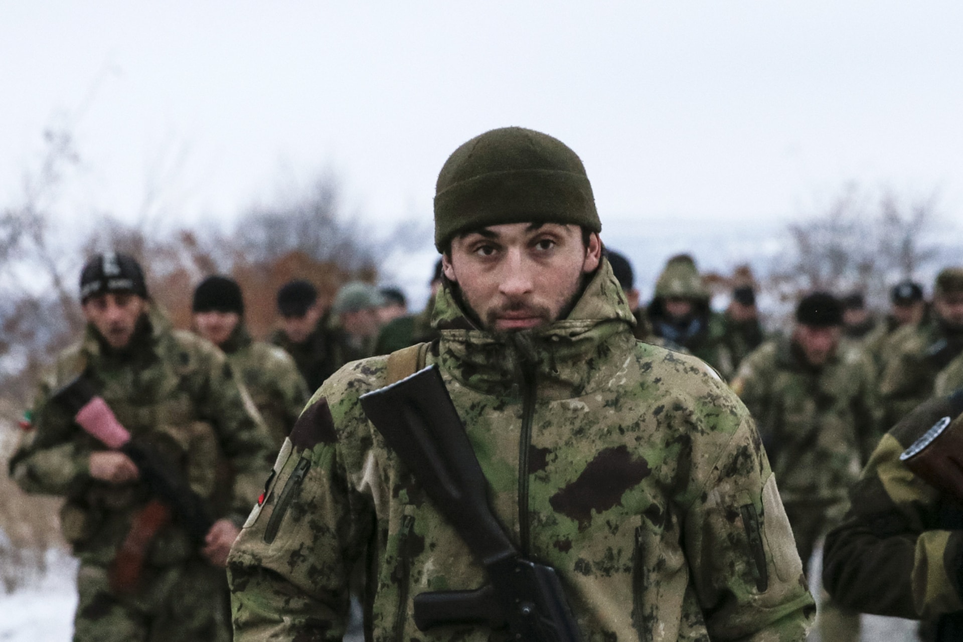 <p>Pro-Russian separatists from the Chechen “Death” battalion walk during a training exercise in the territory controlled by the self-proclaimed Donetsk People’s Republic, eastern Ukraine, on December 8, 2014.</p>

