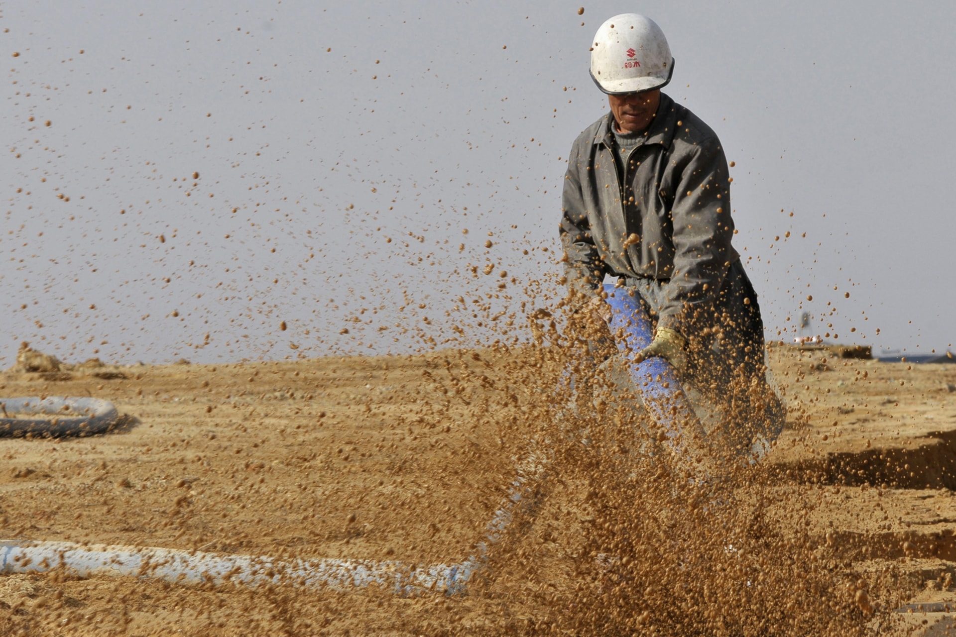 <p>A worker waters the site of a rare earth metals mine at Nancheng county, Jiangxi province on December 30, 2010. </p>
