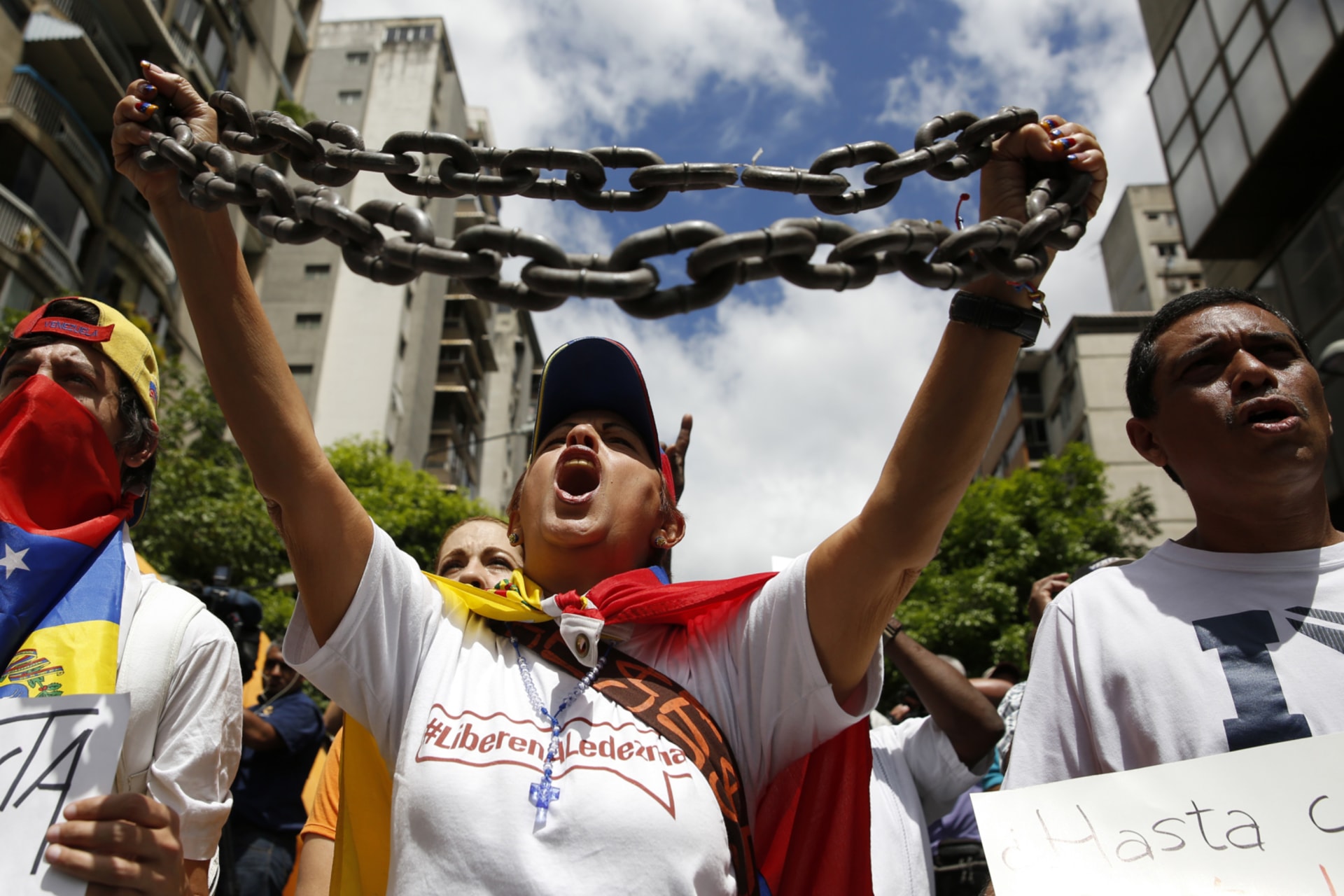 <p>Opposition supporters shout during a gathering to protest against the Venezuelan government and in support of jailed opposition leaders Leopoldo Lopez and Antonio Ledezma in Caracas on February 28, 2015.</p>