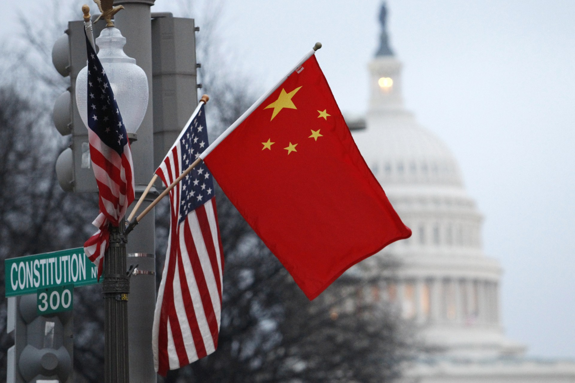 <p>The People’s Republic of China flag and the U.S. Stars and Stripes fly on a lamp post along Pennsylvania Avenue near the U.S. Capitol in Washington DC.</p>
