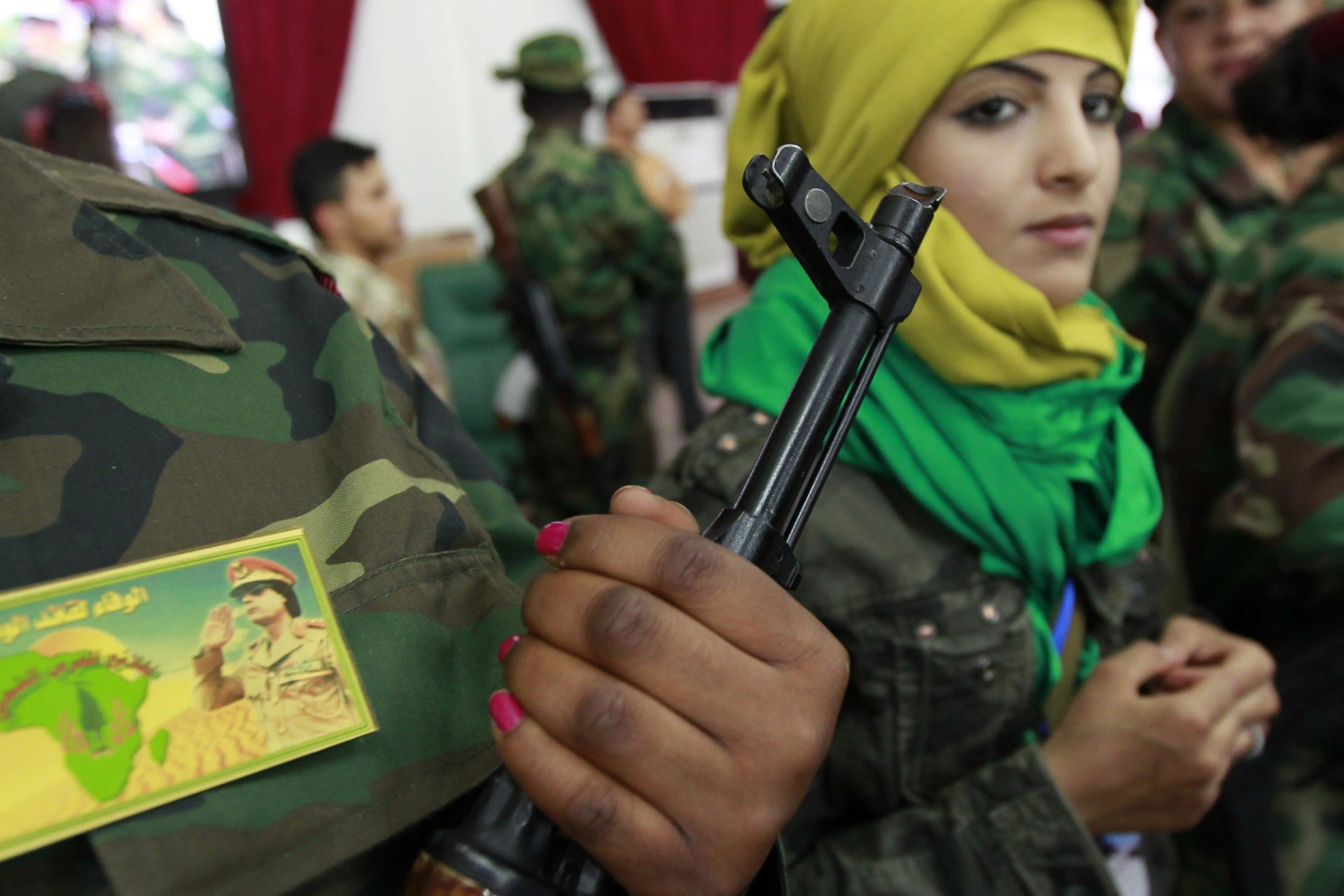 <p>Female volunteer government fighters attend a women’s forum in Tripoli on June 26, 2011.</p>
