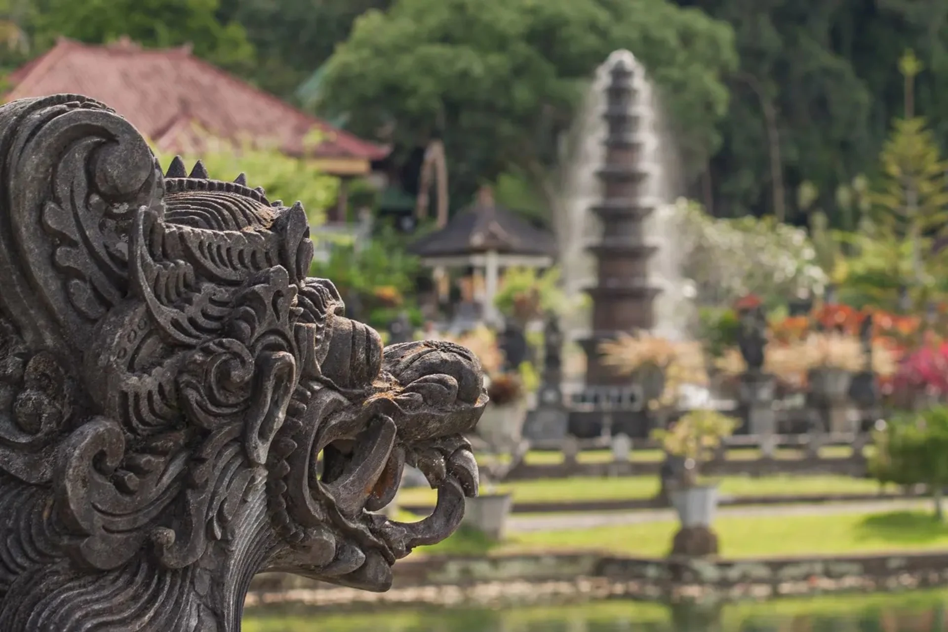 Stone carving of a Bali lion head.