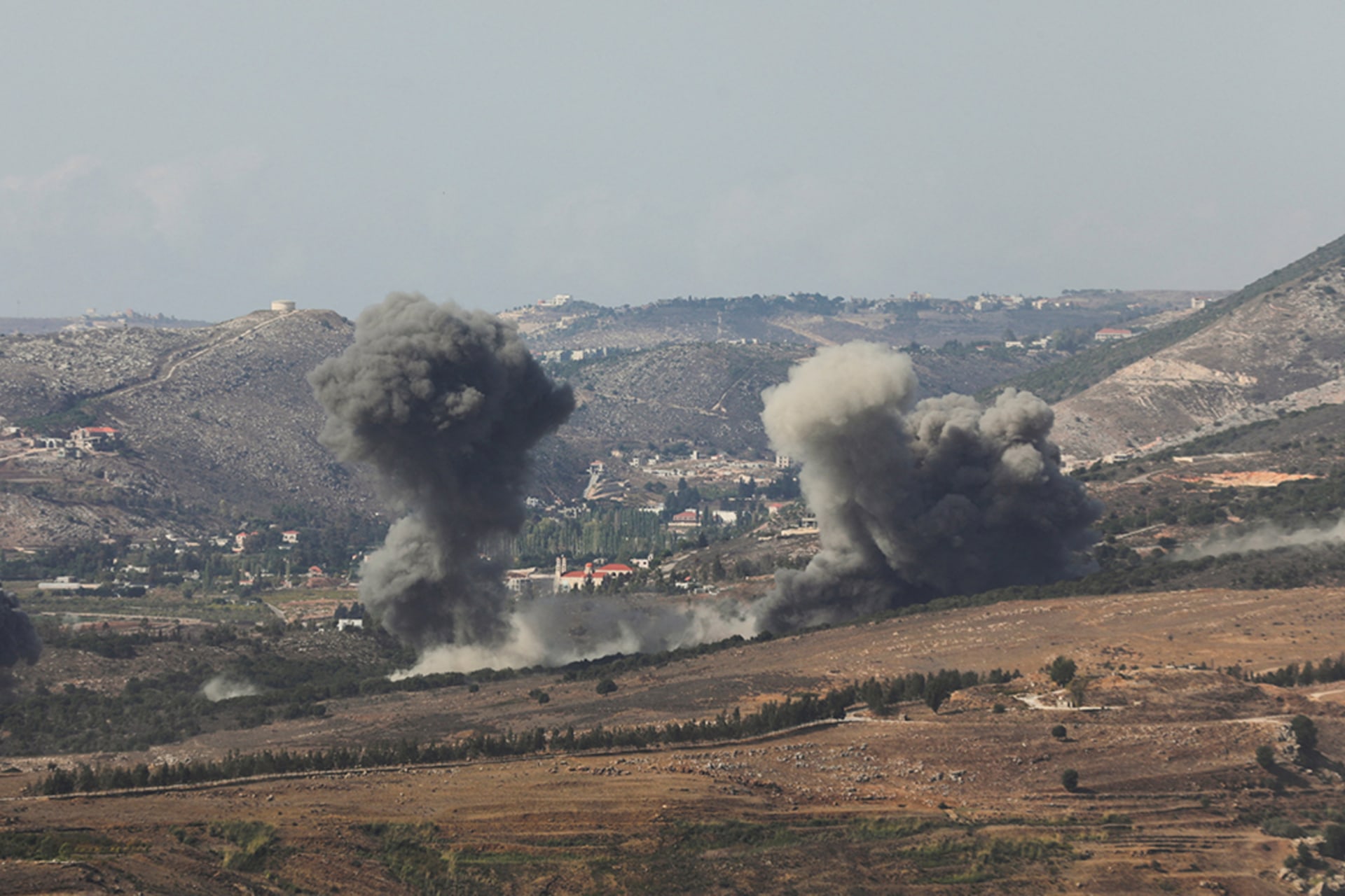 <p>Smoke billows over the village of Aaichiyeh after Israeli strikes, as seen from Marjayoun in southern Lebanon, October 20, 2025. </p>
