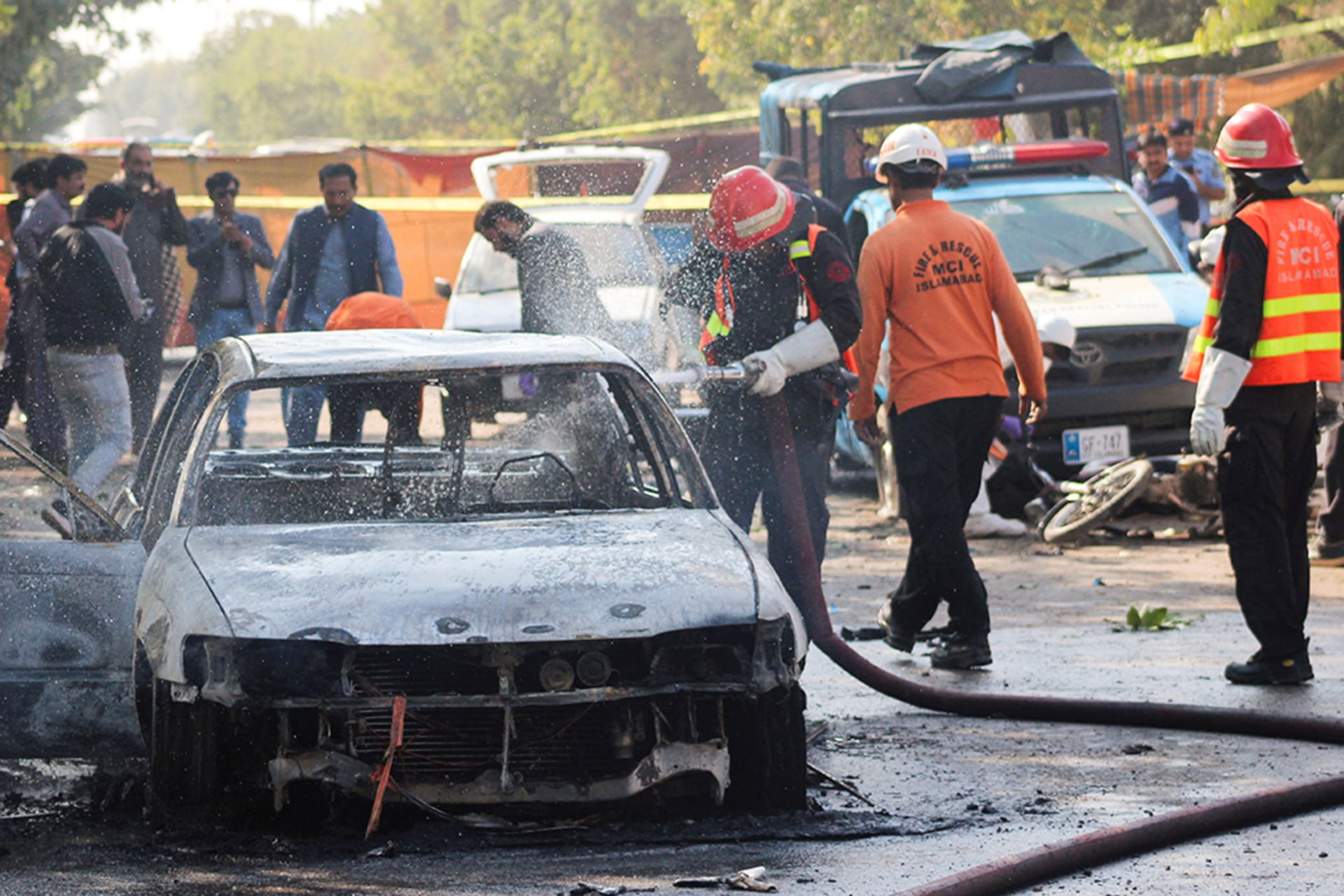 <p>Firefighter douses a vehicle after a blast outside a court building in Islamabad, Pakistan November 11, 2025. </p>
