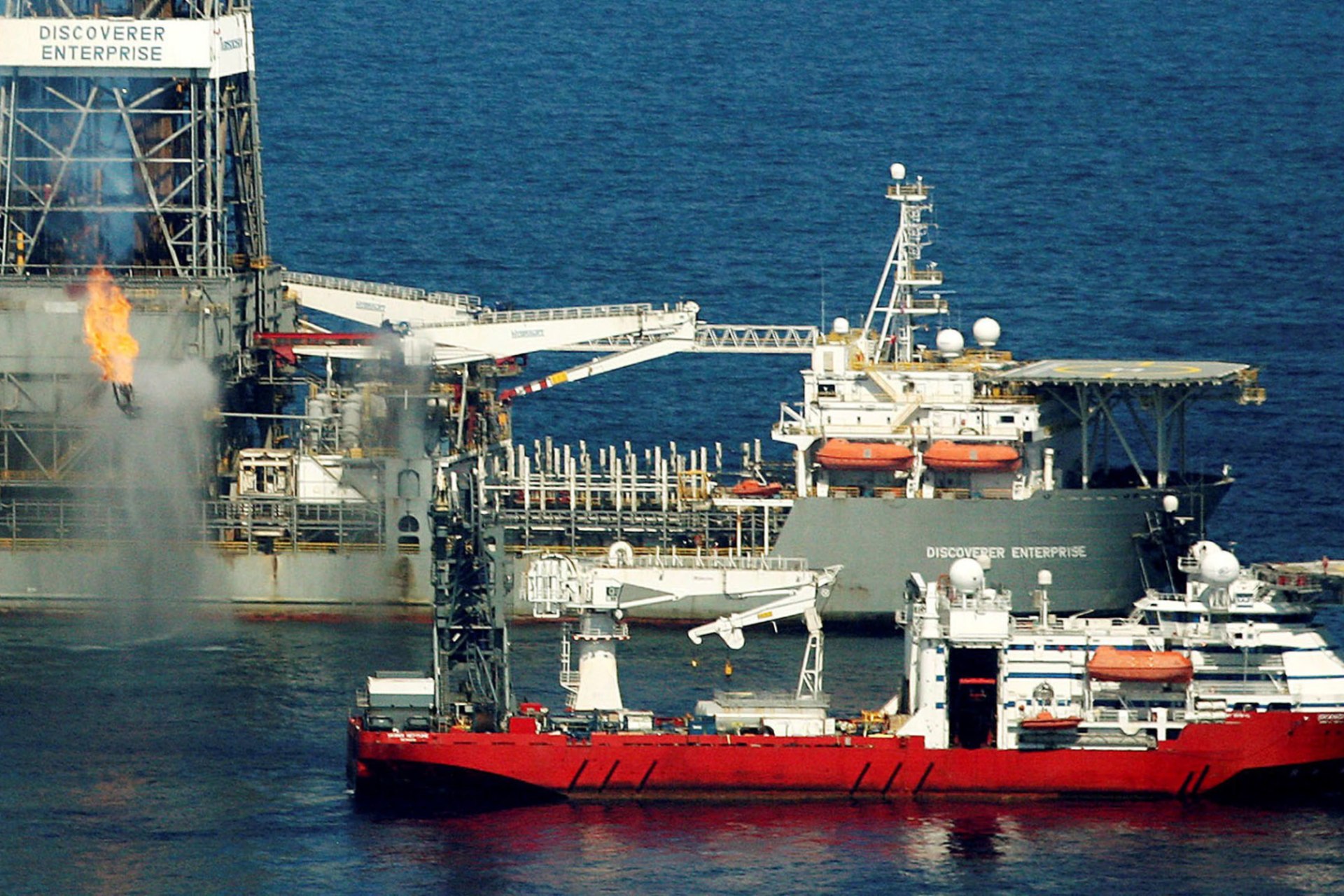 <p>The Discoverer Enterprise drill ship uses a flare to burn natural gas and oil from an insertion pipe connected to the broken oil well under the surface at the BP oil spill site on May 22, 2010.</p>

