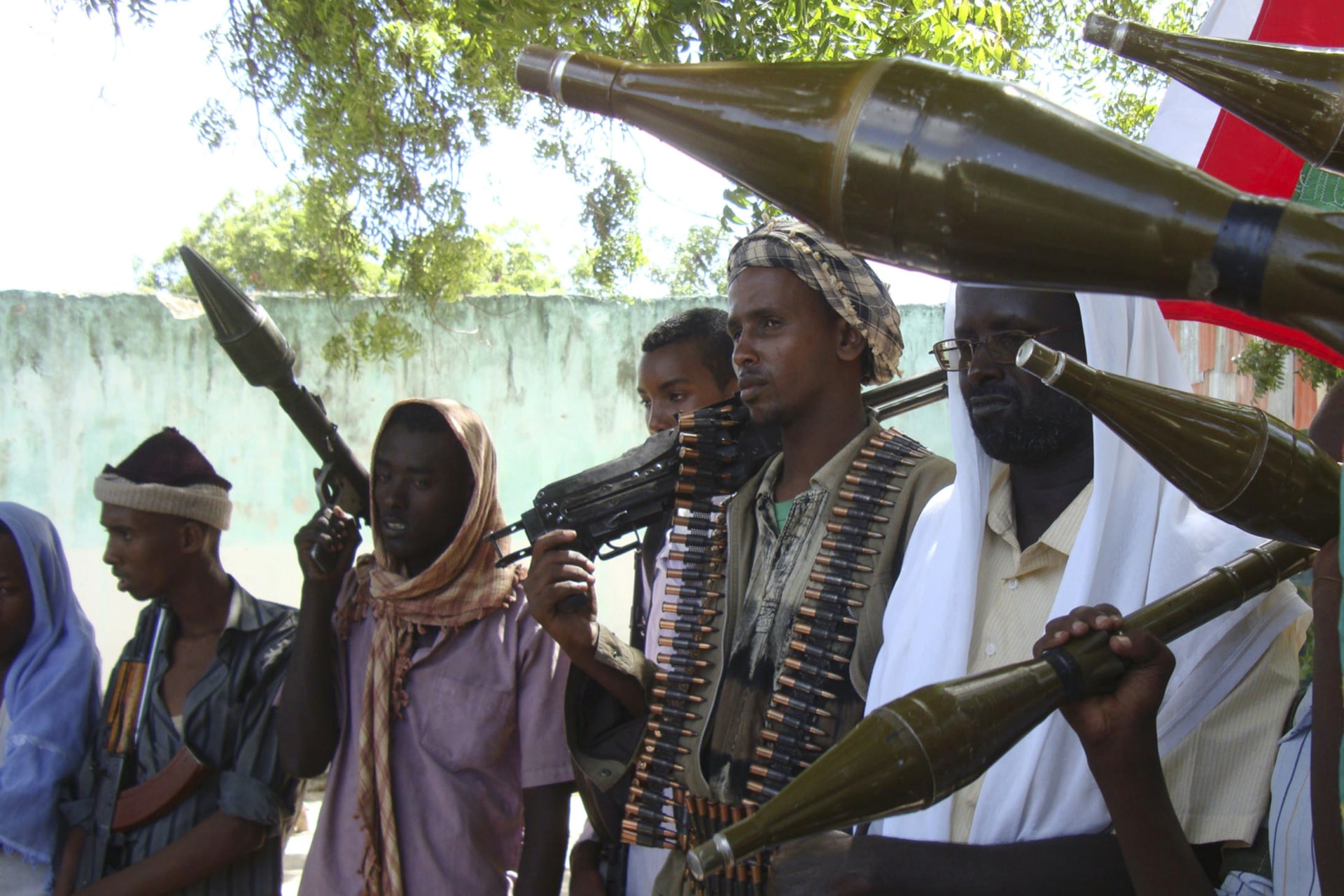 <p>Somali militants from the pro-government Ahlu Sunna Waljamaca (ASWJ) group carry their weapons during a military exercise in the Bermuda neighborhood of southern Mogadishu on May 15, 2010.</p>
