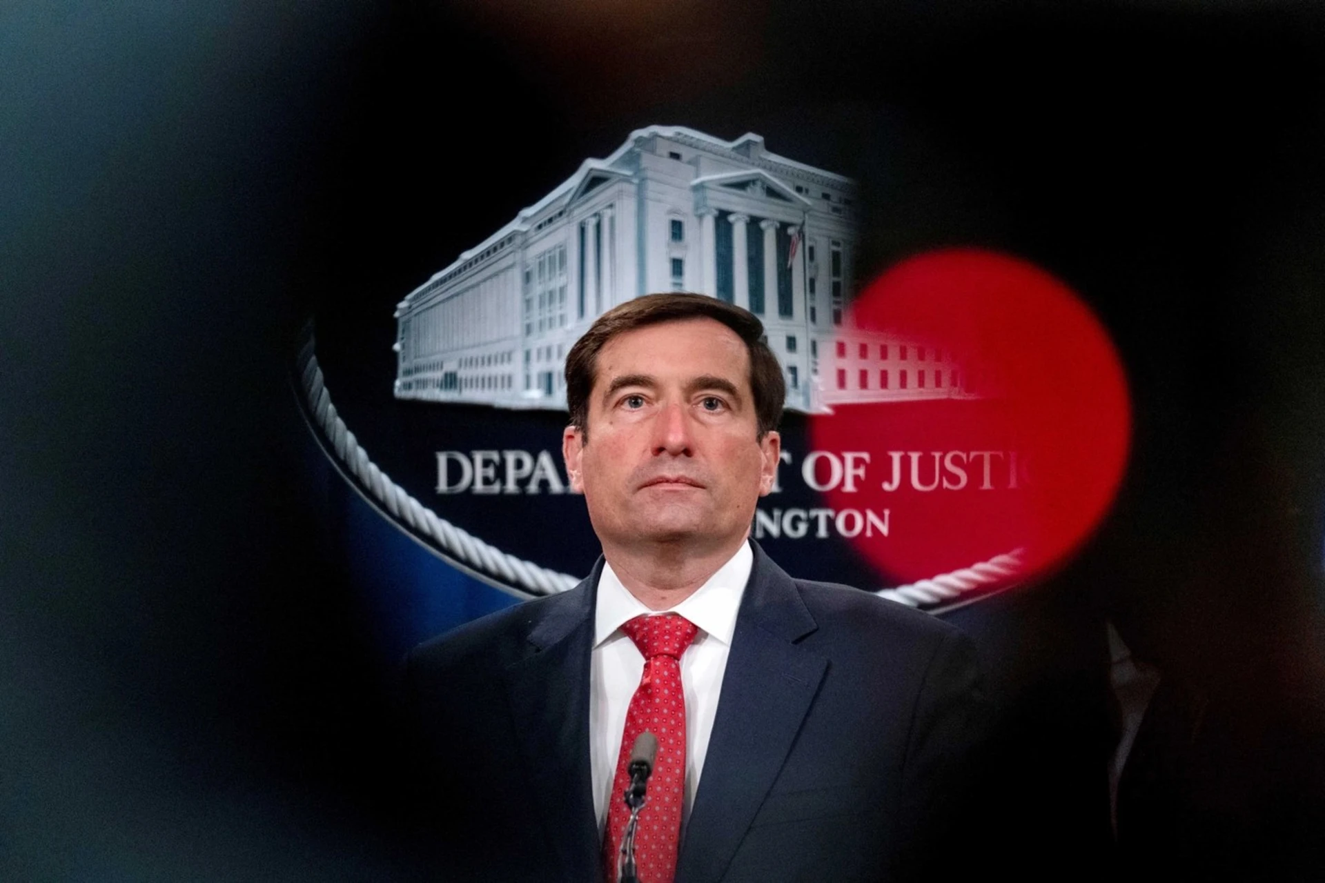 U.S. Assistant Attorney General for the National Security Division John Demers takes a question from a reporter. 
