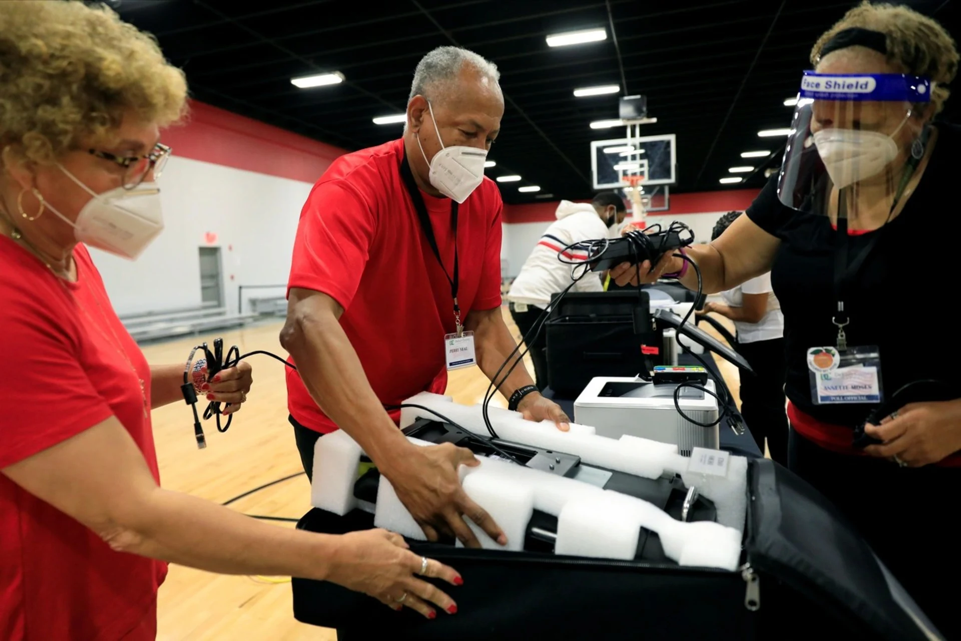 Poll workers pack up voting machines at an early voting location in Georgia.