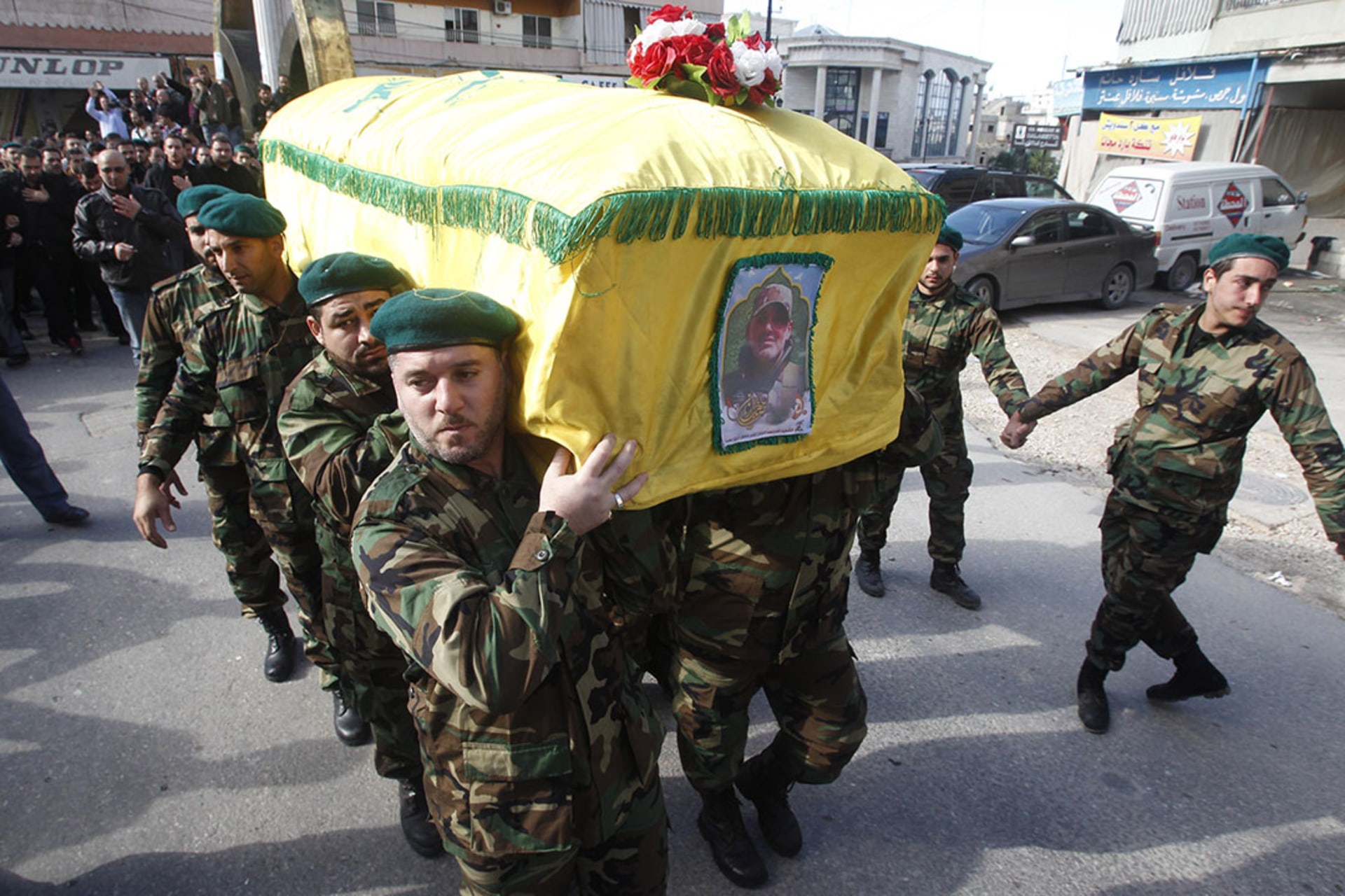 Hezbollah members carry the coffin of commander Ali Bazzi, who was killed in Syria. 