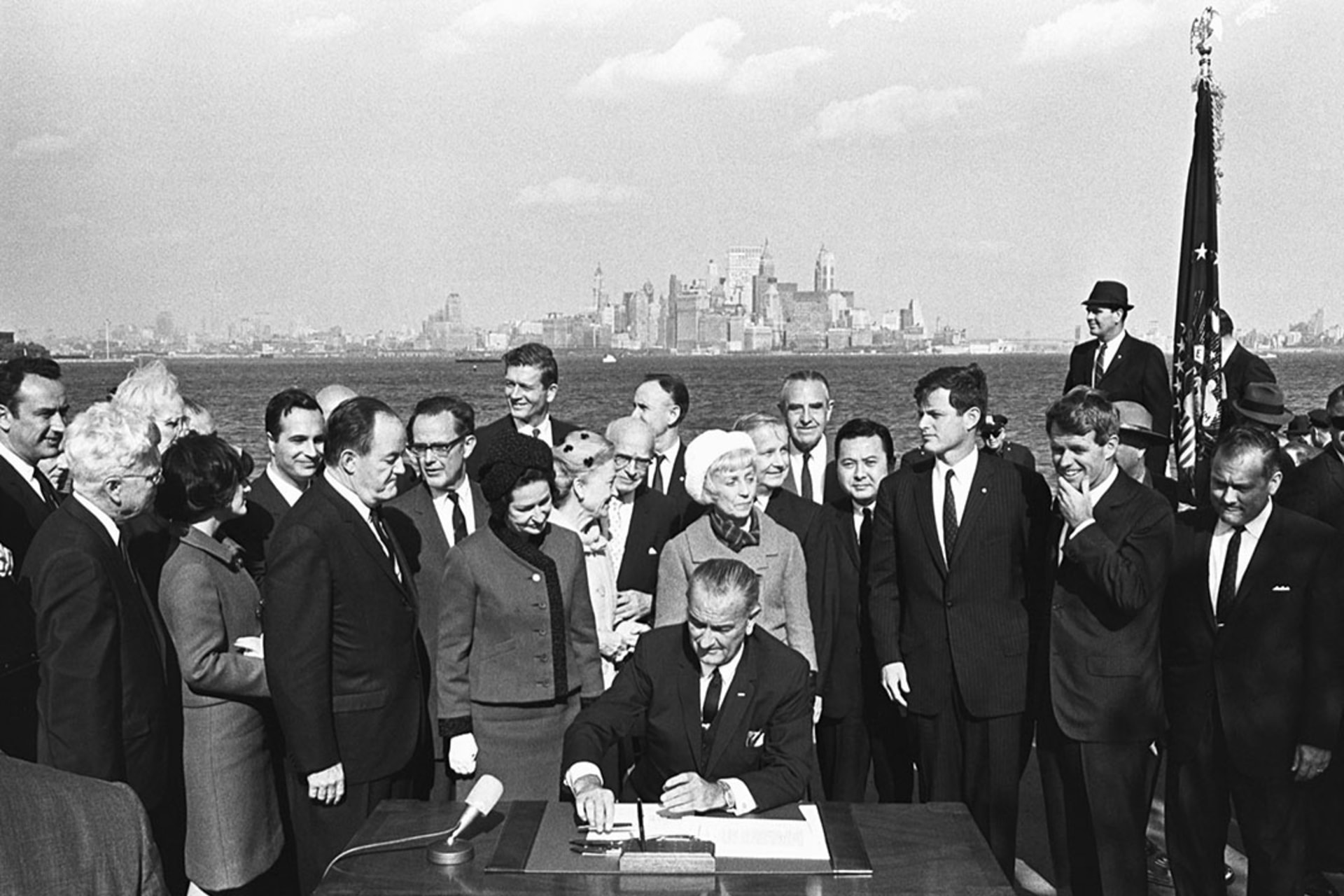 President Lyndon B. Johnson signs the 1965 Immigration Act at the foot of the Statue of Liberty. Yoichi Okamoto/Corbis/Getty Images