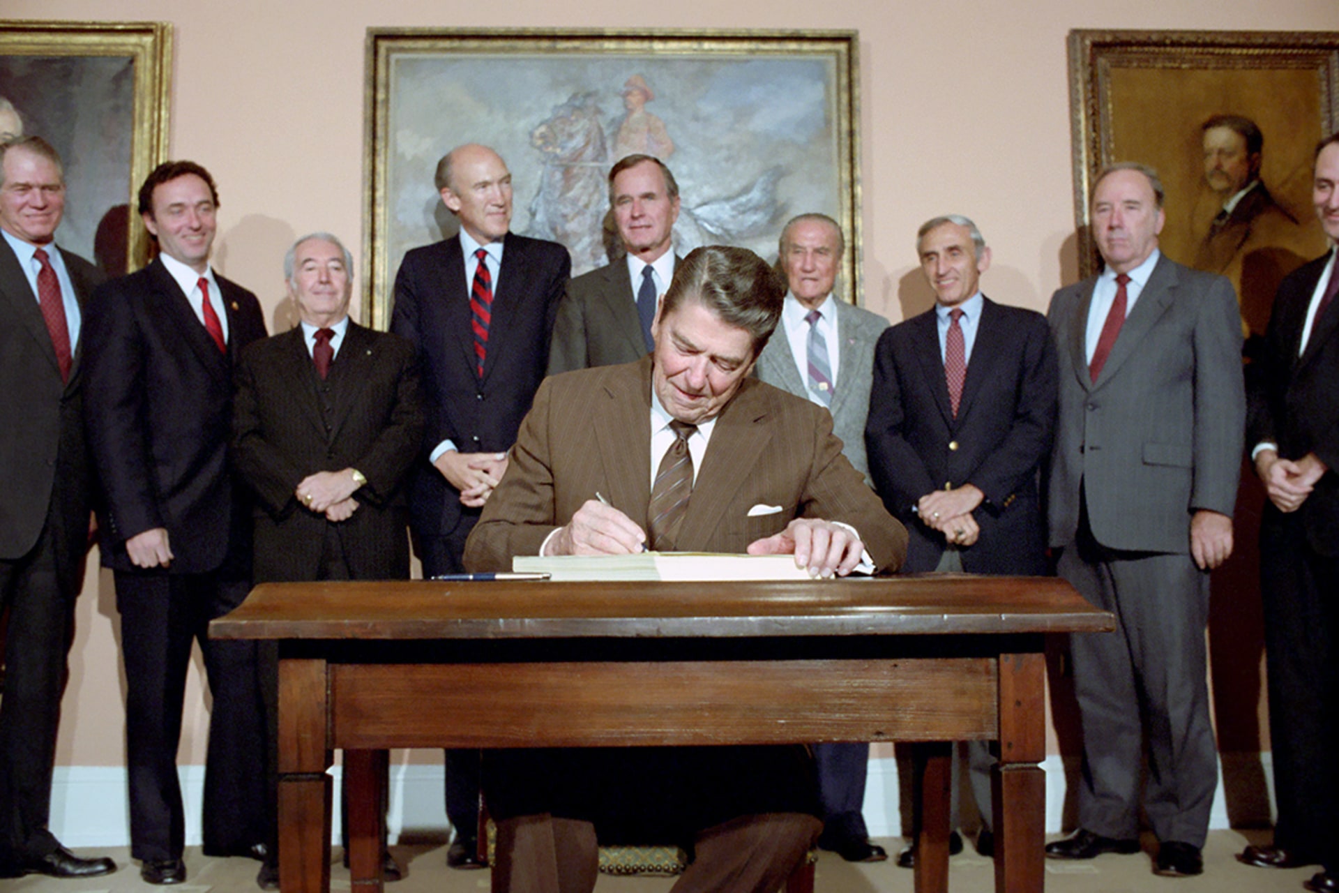 President Ronald Reagan signs the Immigration Reform and Control Act. National Archives