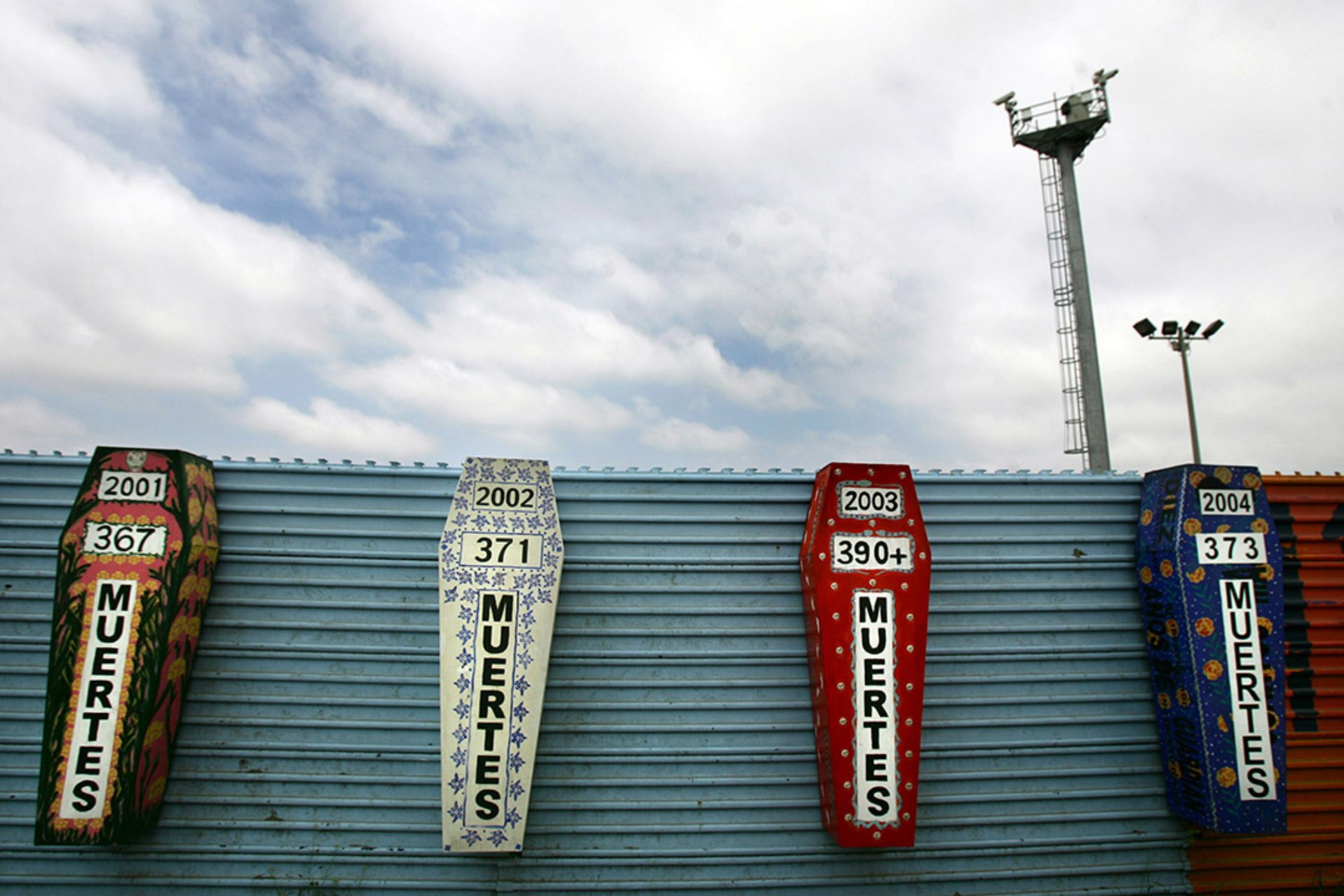 An artist’s representation of coffins inscribed with the number of immigrants who died each year while attempting to cross the border between Mexico and the United States. Reuters