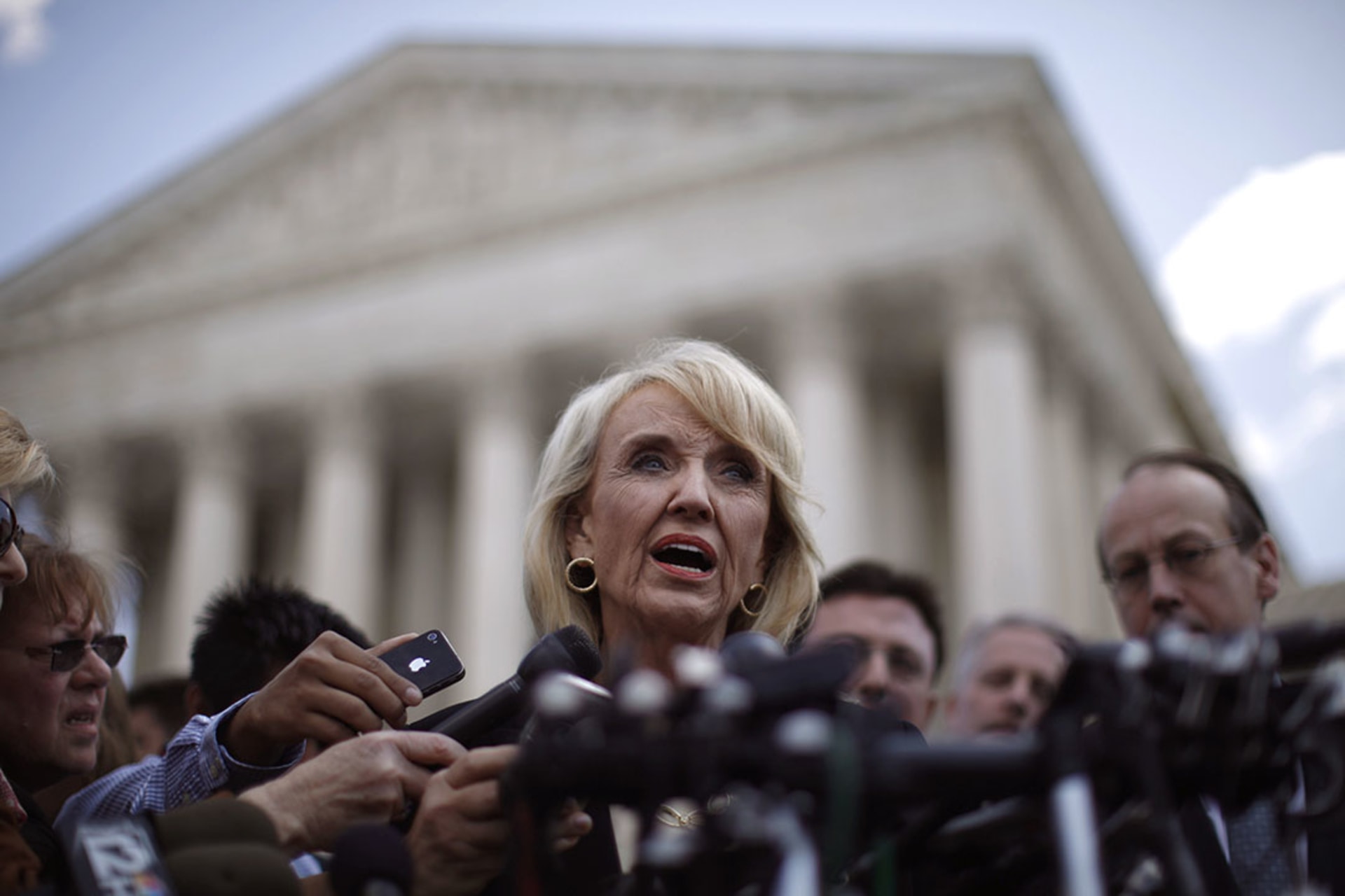 Arizona Governor Jan Brewer addresses the press outside the U.S. Supreme Court following oral arguments over SB1070. Jason Reed/Reuters